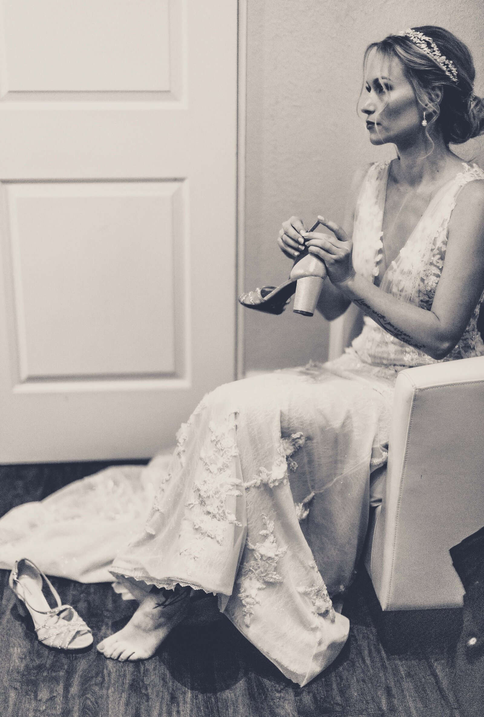 Capture the intimate and serene moments of a bride's preparations with our stunning photograph featuring a bride delicately putting on her elegant shoes. This image embodies the excitement and beauty of the final touches before walking down the aisle. Explore more heartfelt wedding preparation photos in our collection to inspire your own bridal journey.
