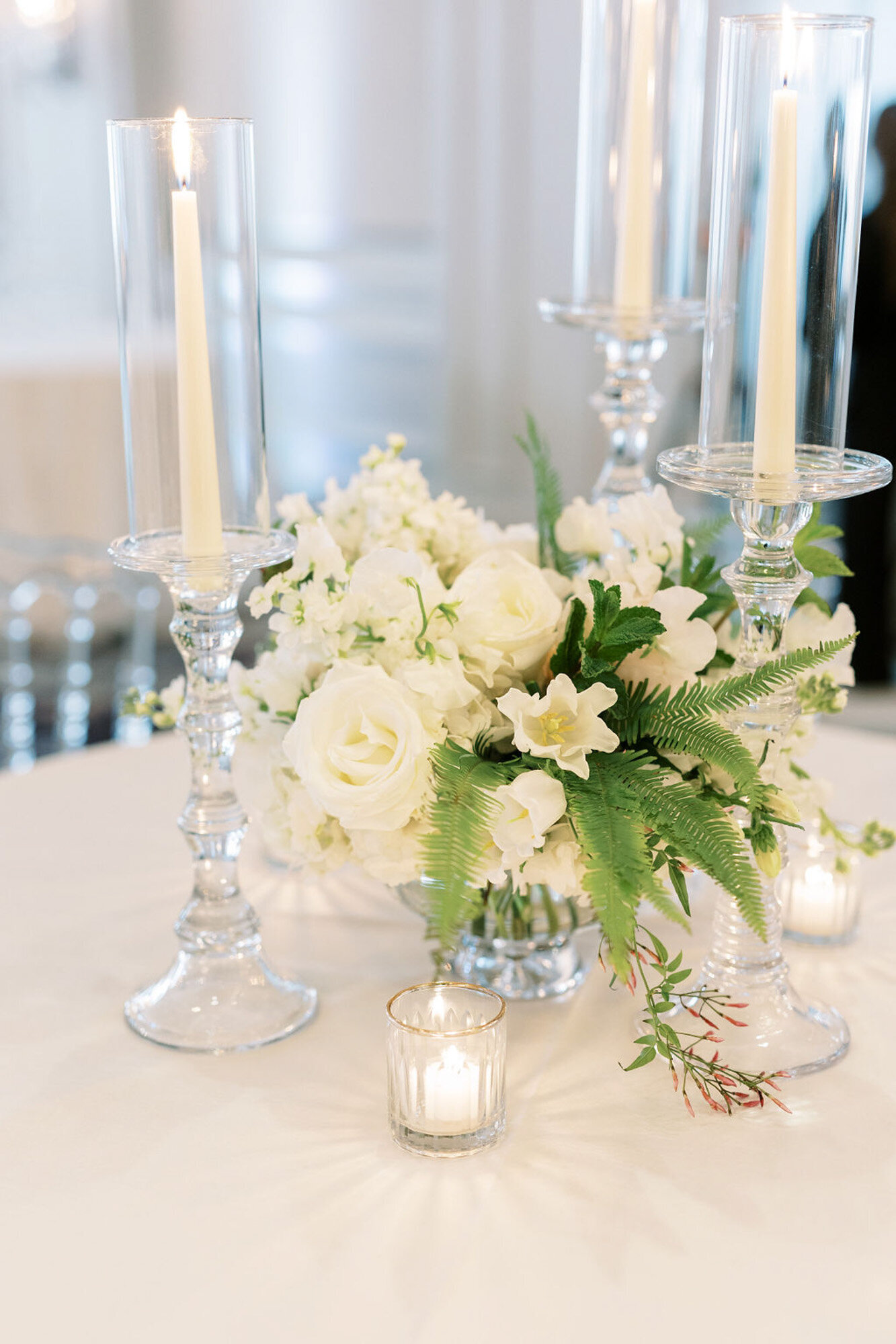 white floral centerpiece design at luxury wedding