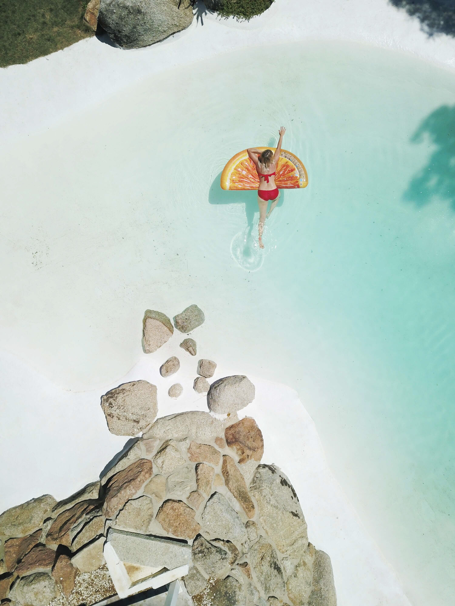 Woman on a floater relaxing in the beach