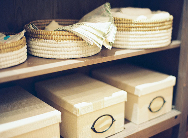 Baskets and boxes on shelves in a nursery.