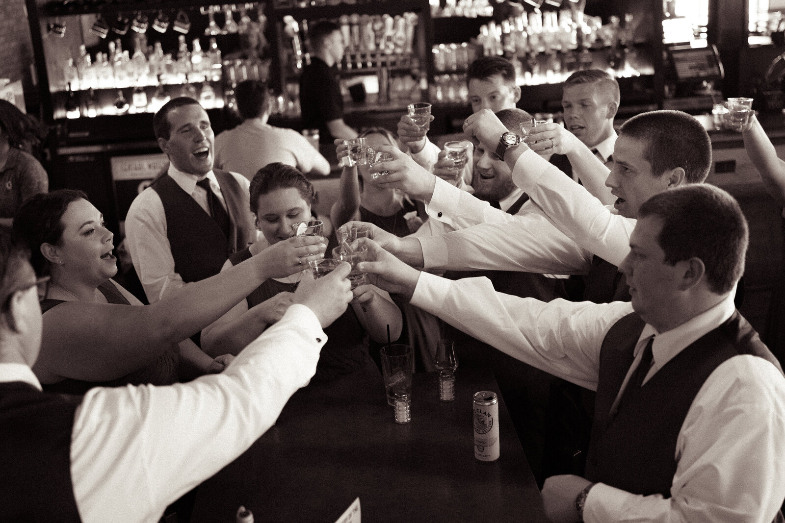 bridal party takes a shot of top shelf tequila to celebrate