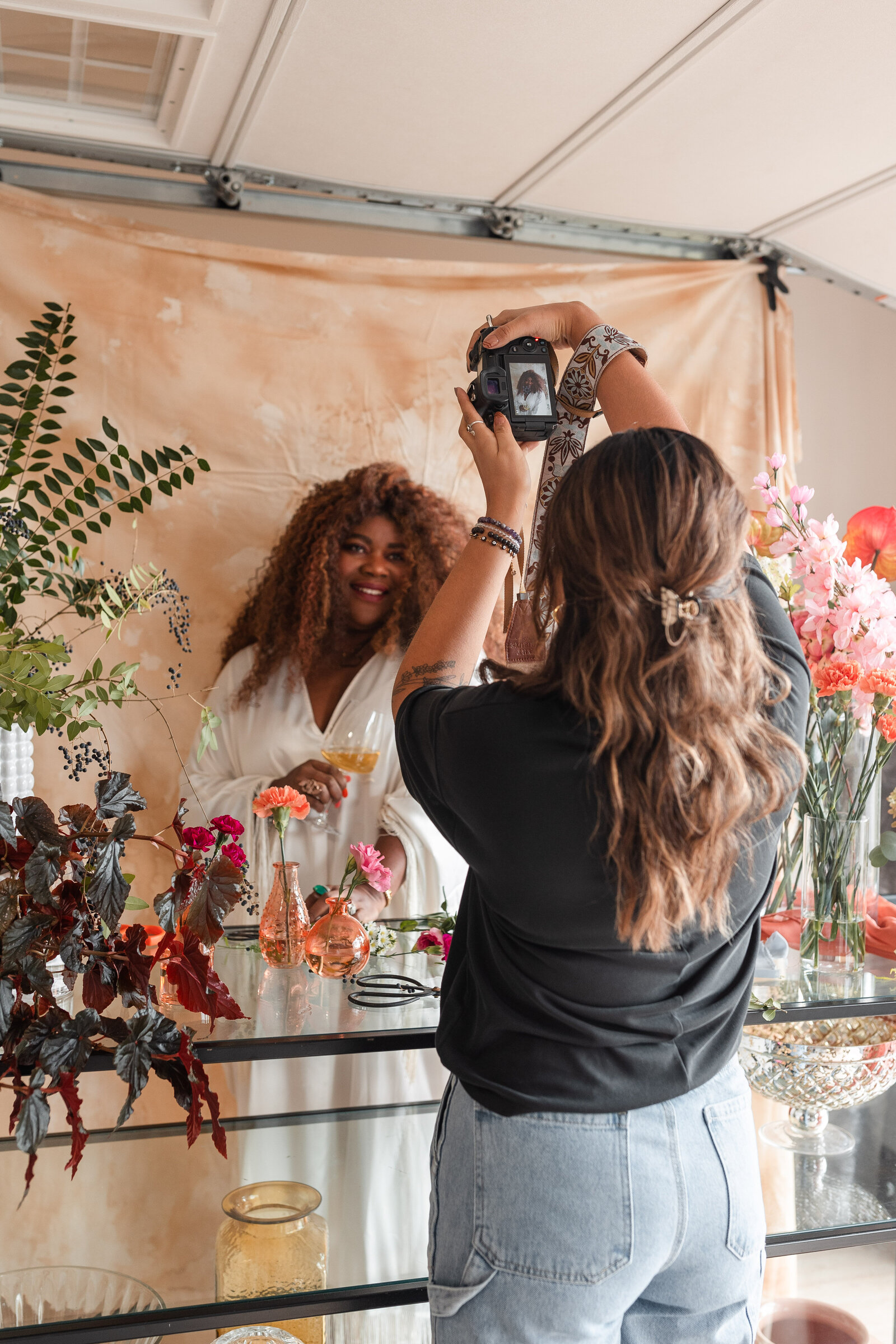 woman photographing event stylist at work