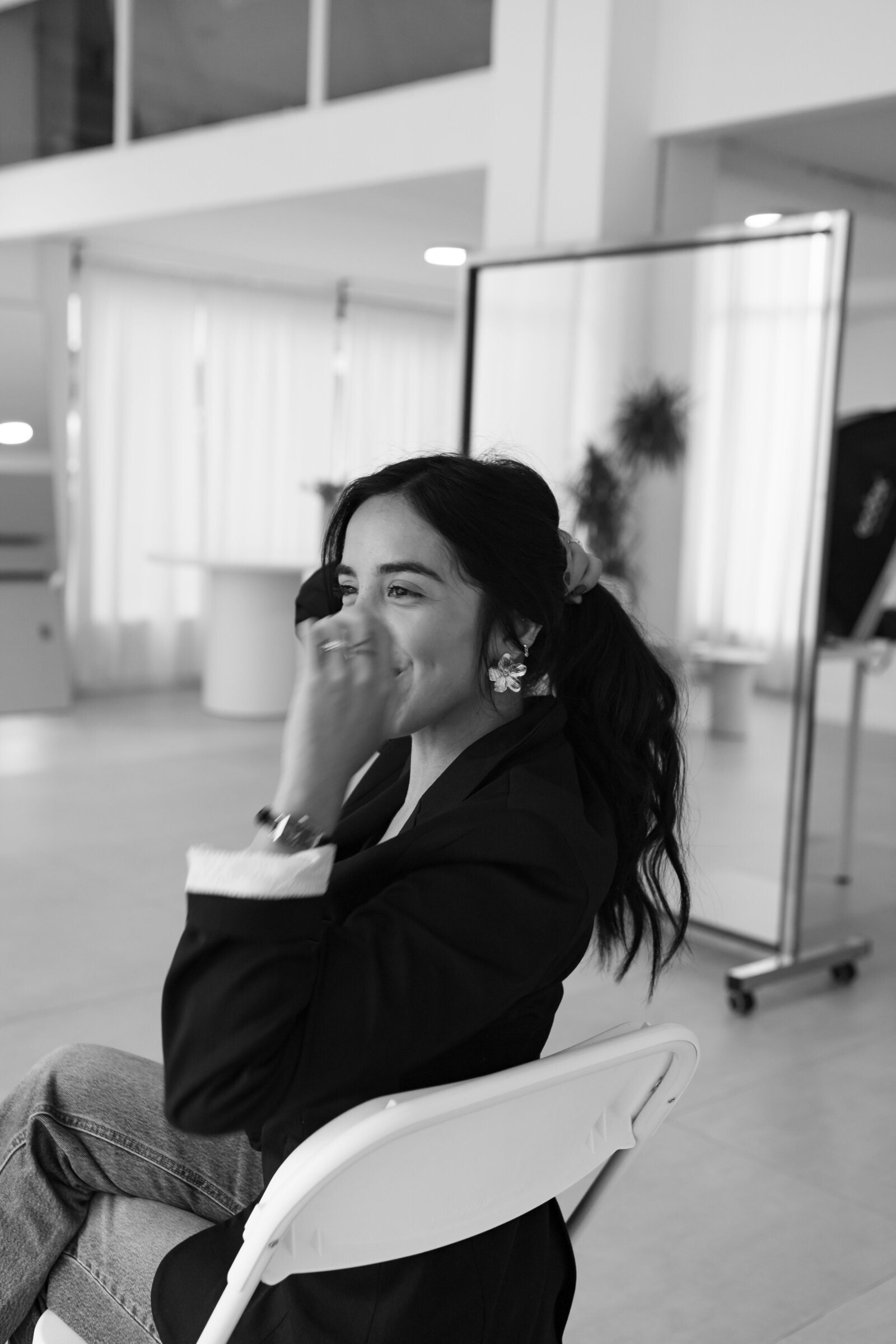 Business women sitting down in black blazer
