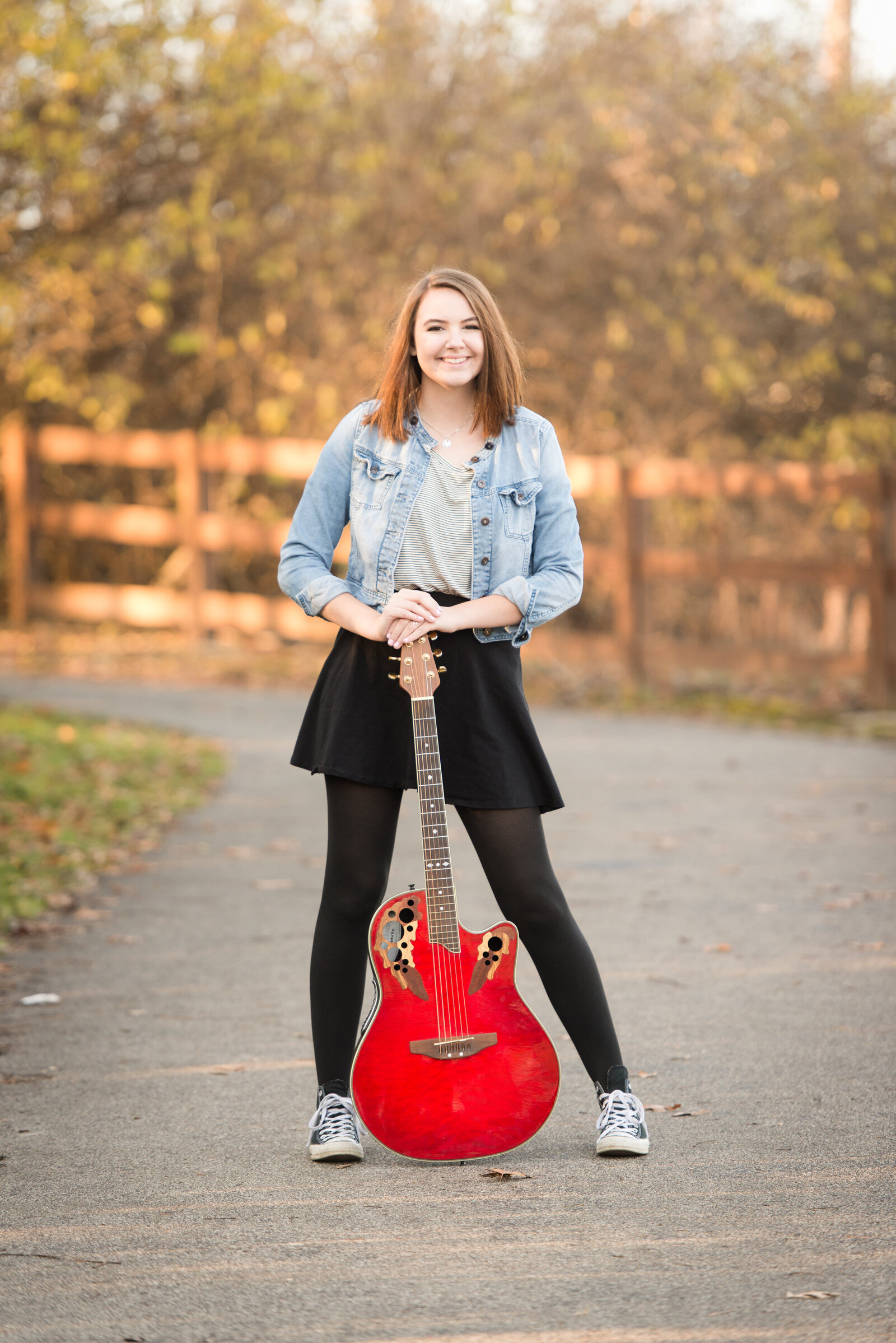 senior girl with an electric guitar