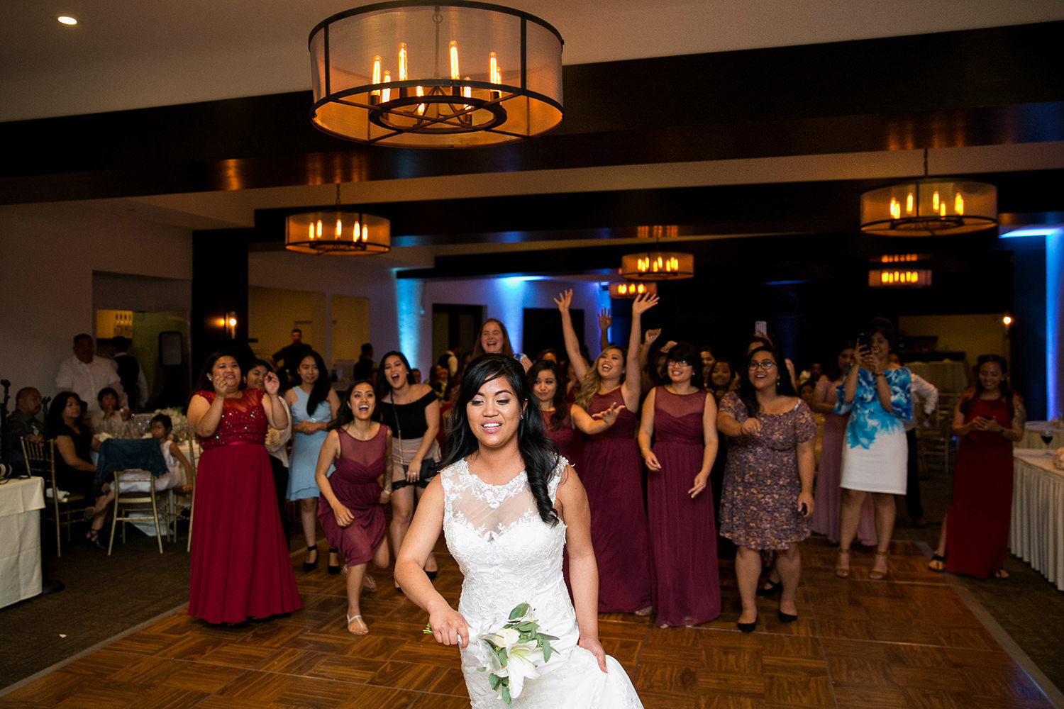 bride tossing her bouquet