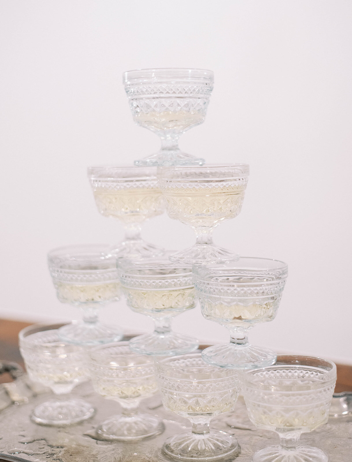 champagne glasses stacked on wedding day