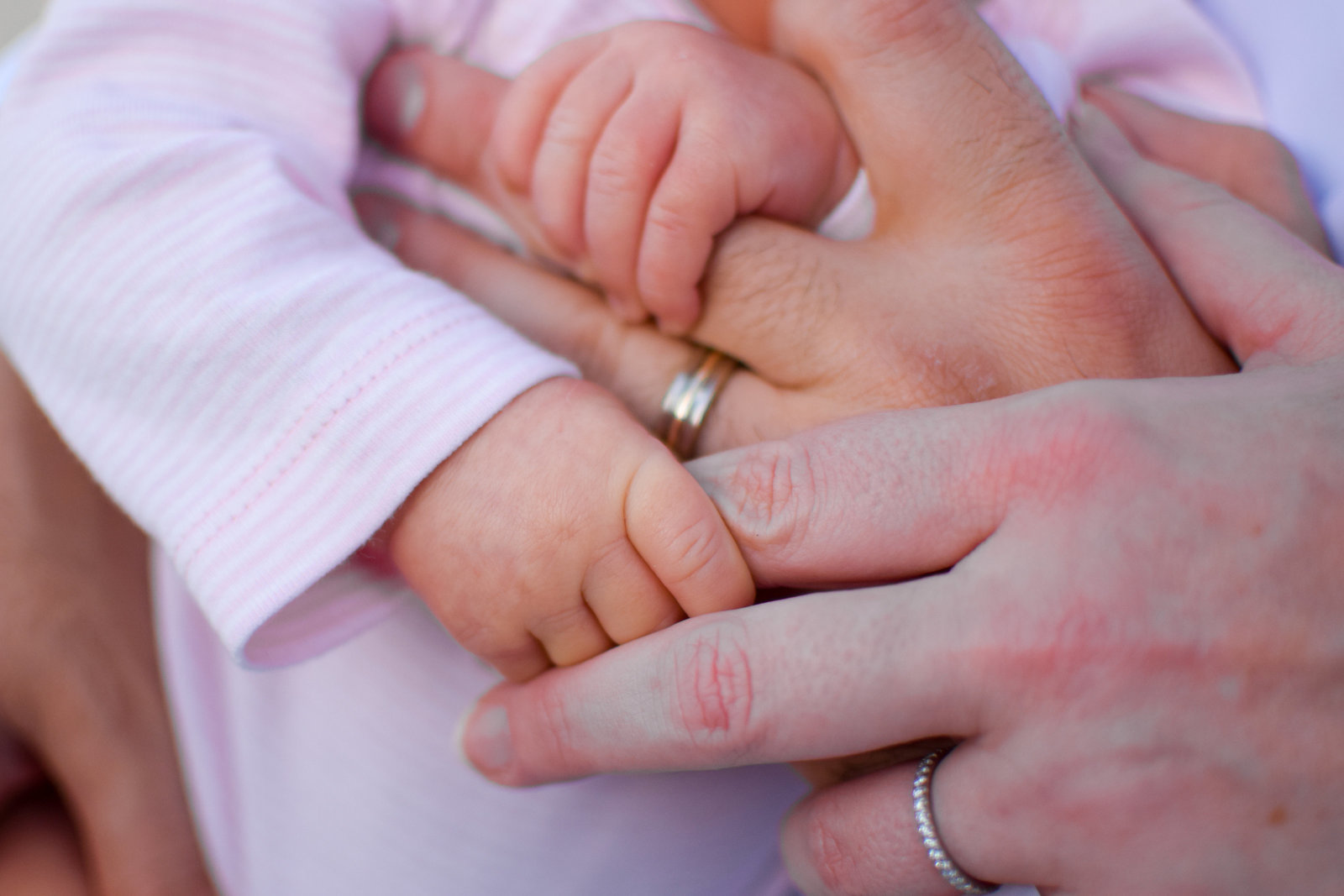 Family newborn girl holding hands Windermere Florida