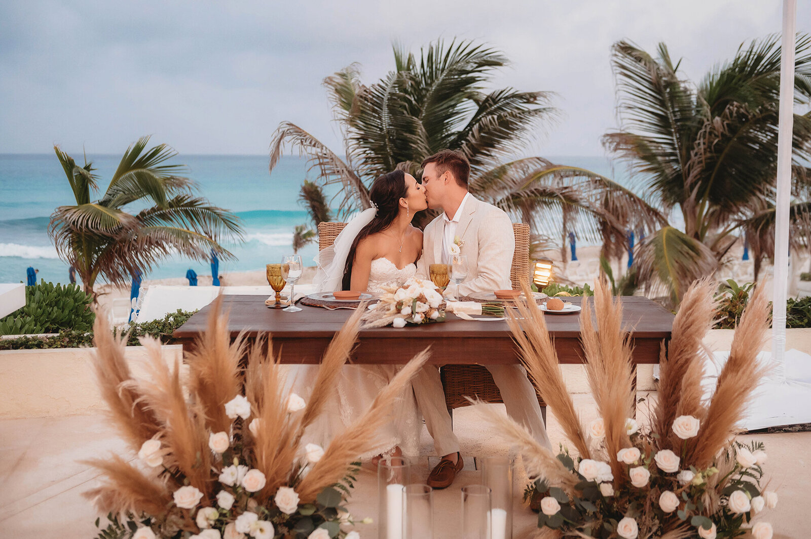 Newlyweds kiss during their Micro-Wedding Reception at Live Aqua Resort in Cancun, Mexico.