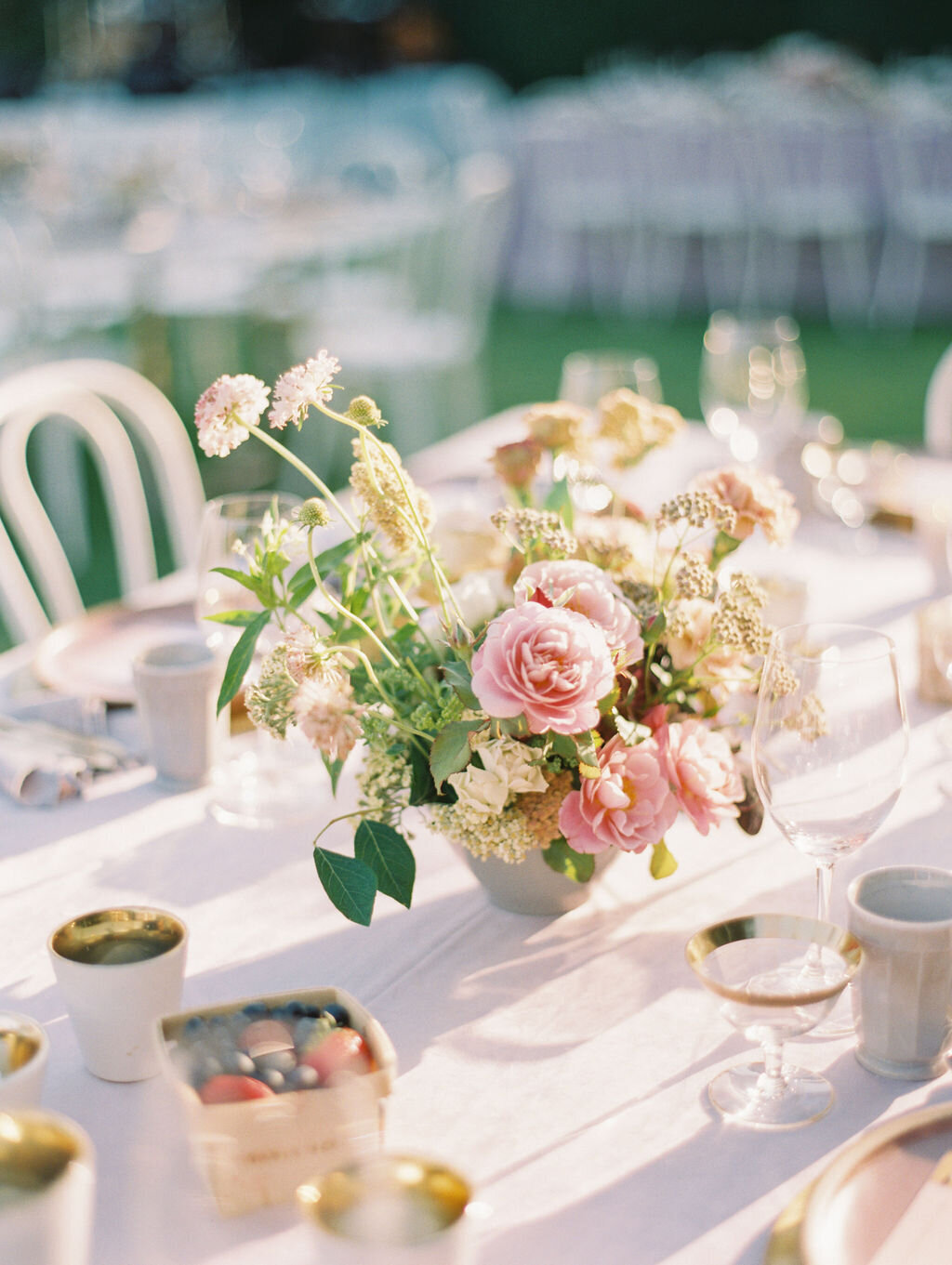 floral centerpieces at wedding reception at luxury outdoor summer wedding at Rancho Valencia