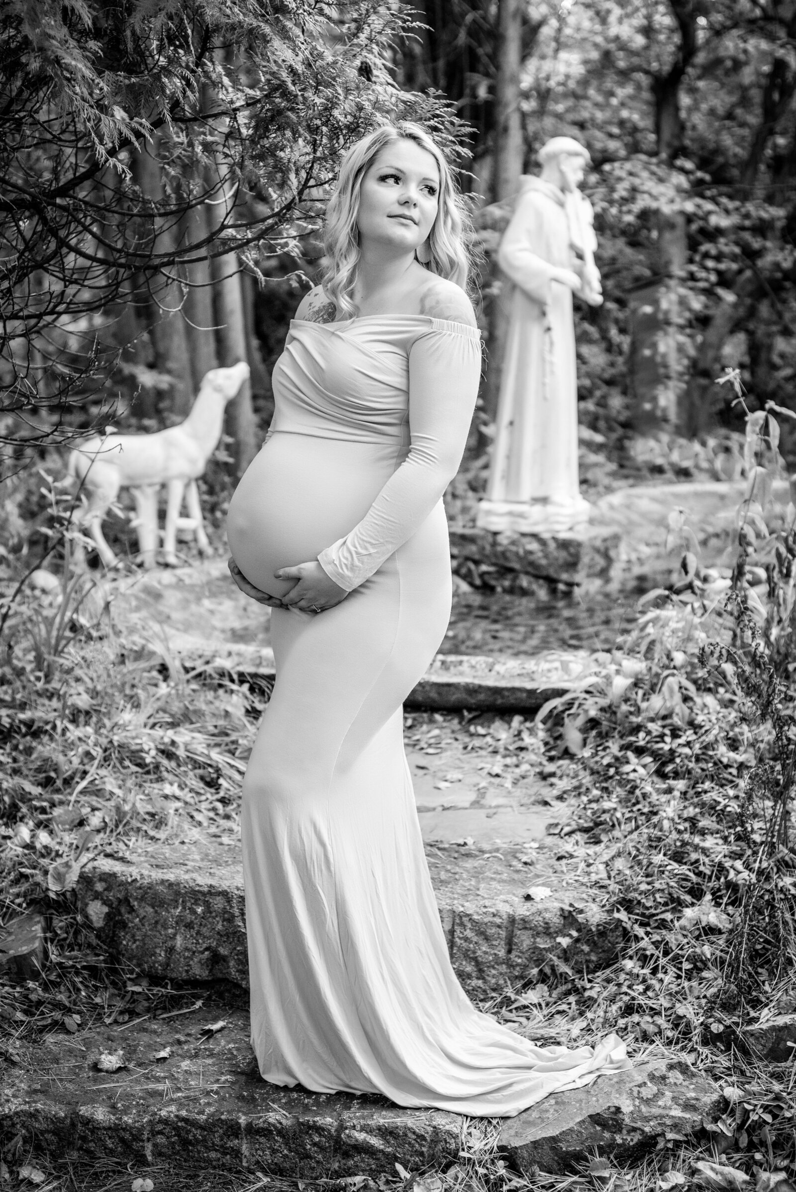 Pregnant woman in garden maternity photo in Wells Maine