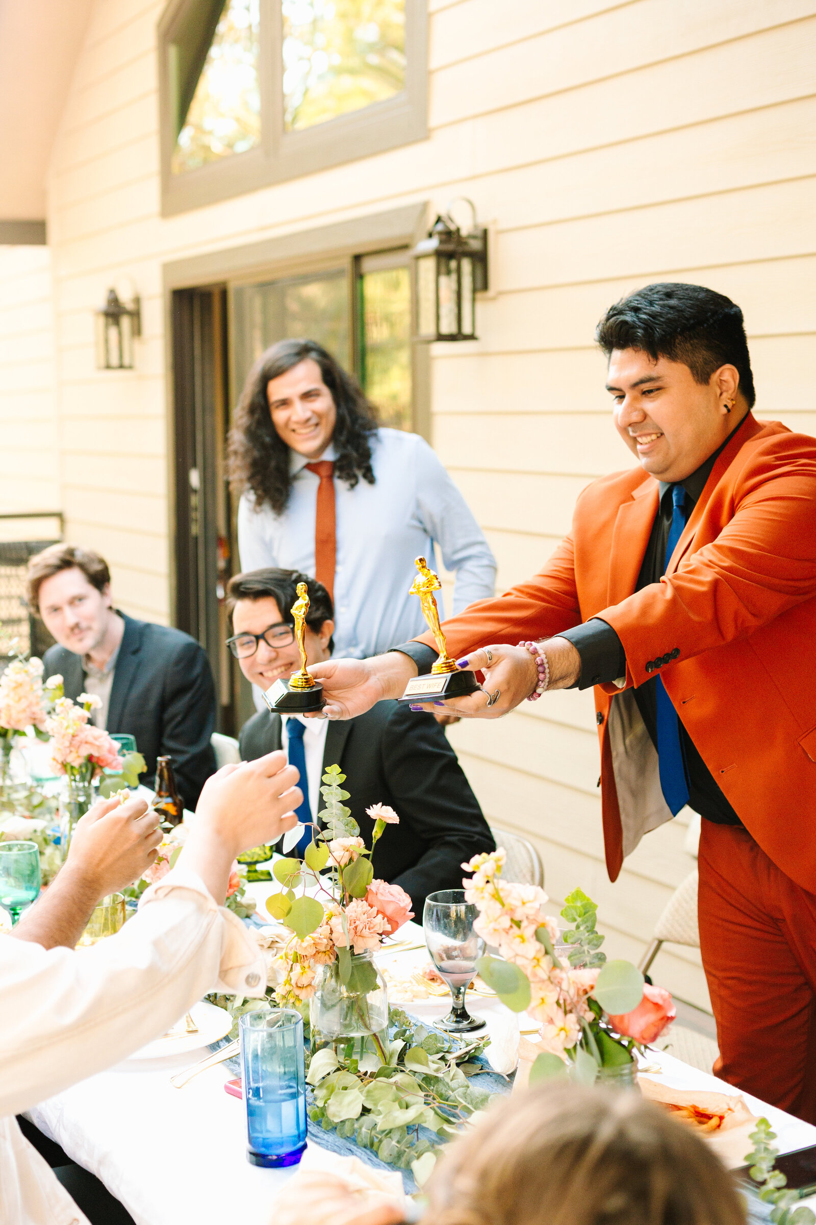 The bridal party celebrates an intimate elopement at a cabin at Big Bear Lake, California.