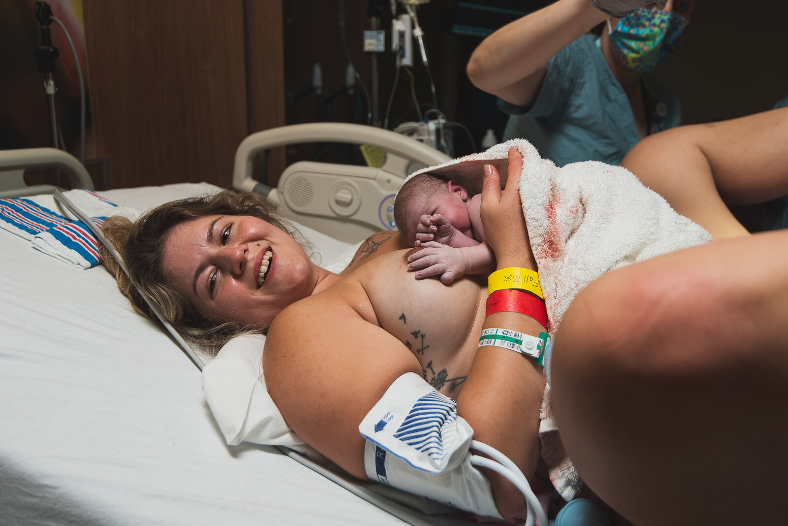 A mother holds her baby for the first time at the UF Health North