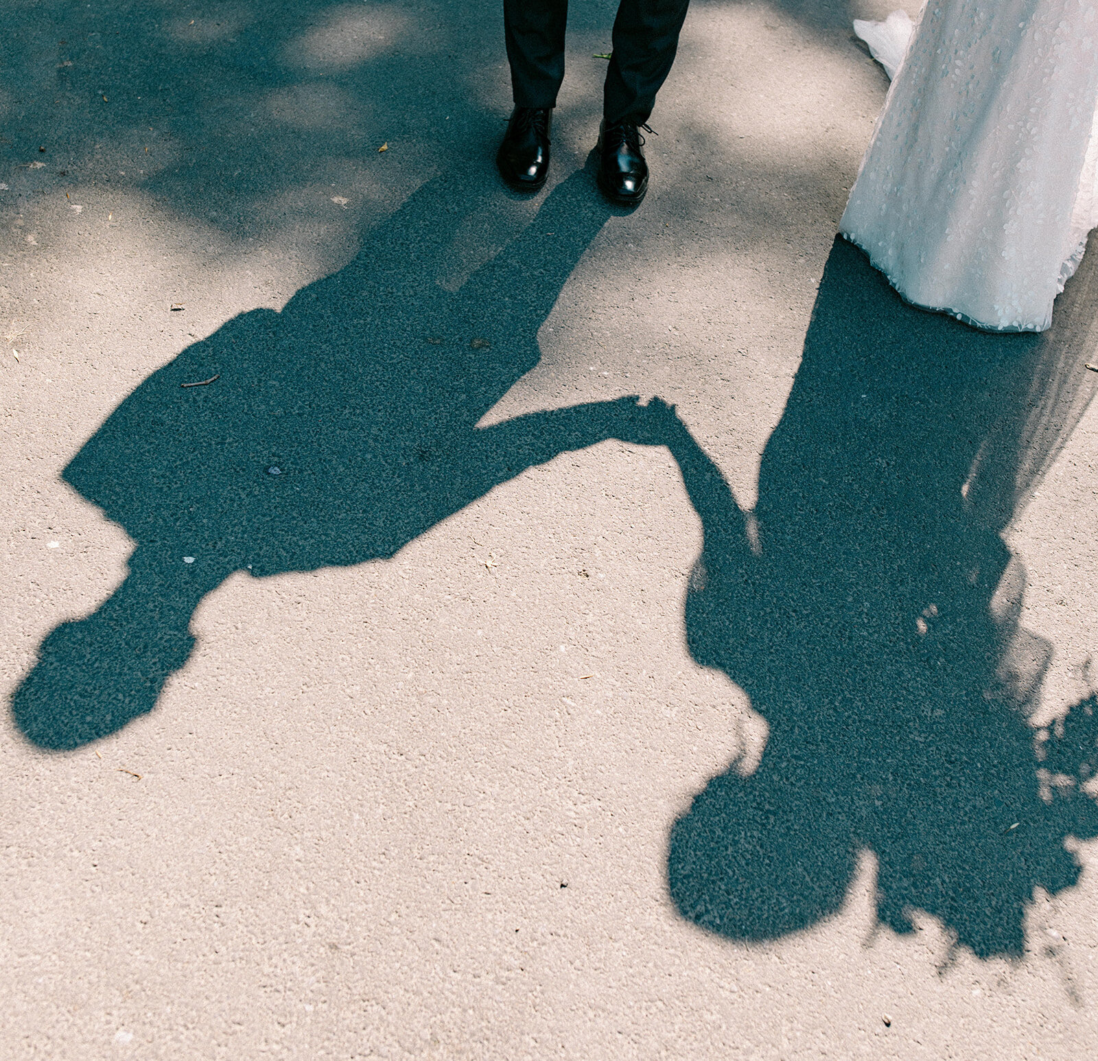 couple's shadow of them holding hands