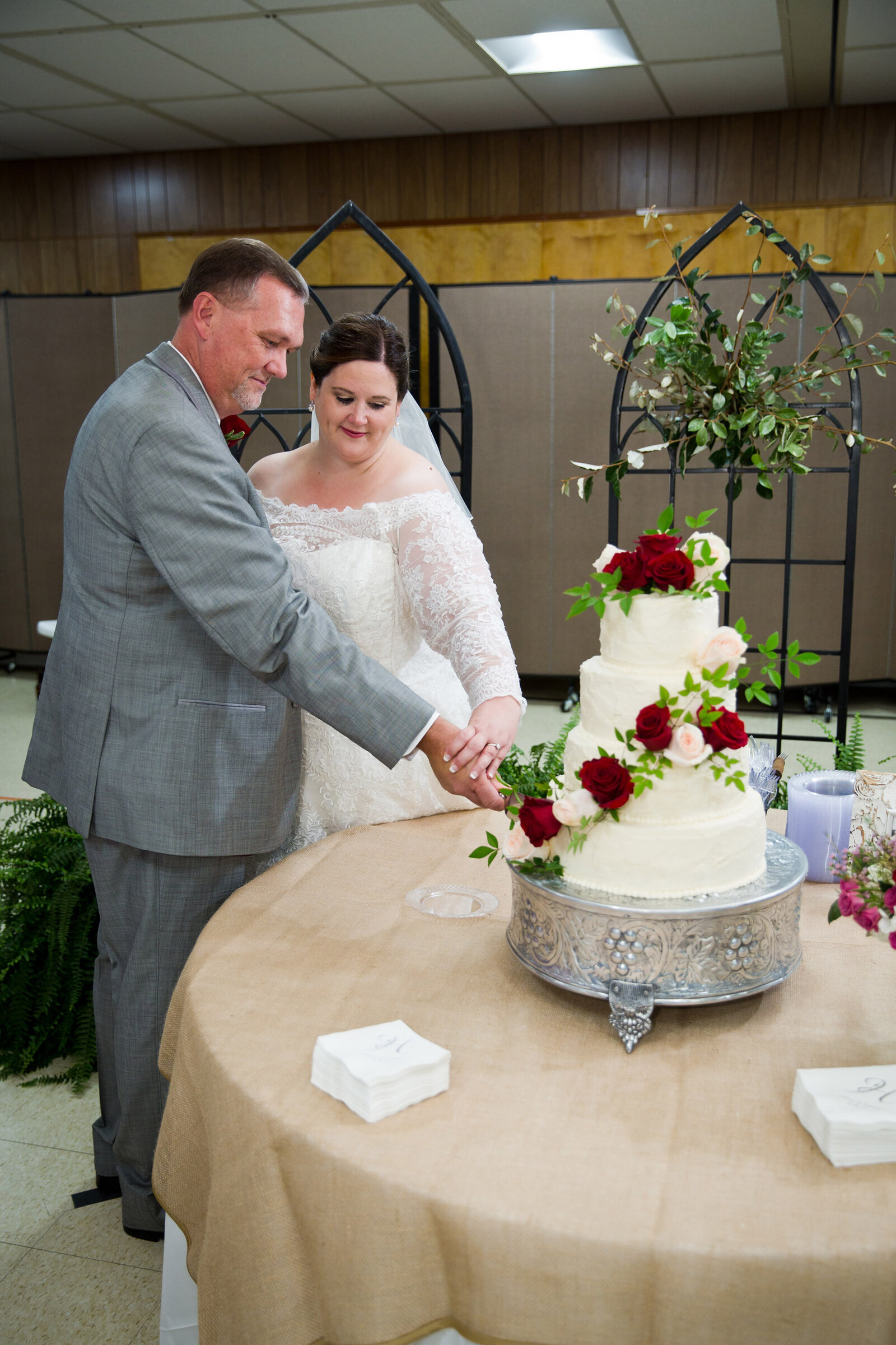 Cake cut bride groom Louisiana wedding church reception