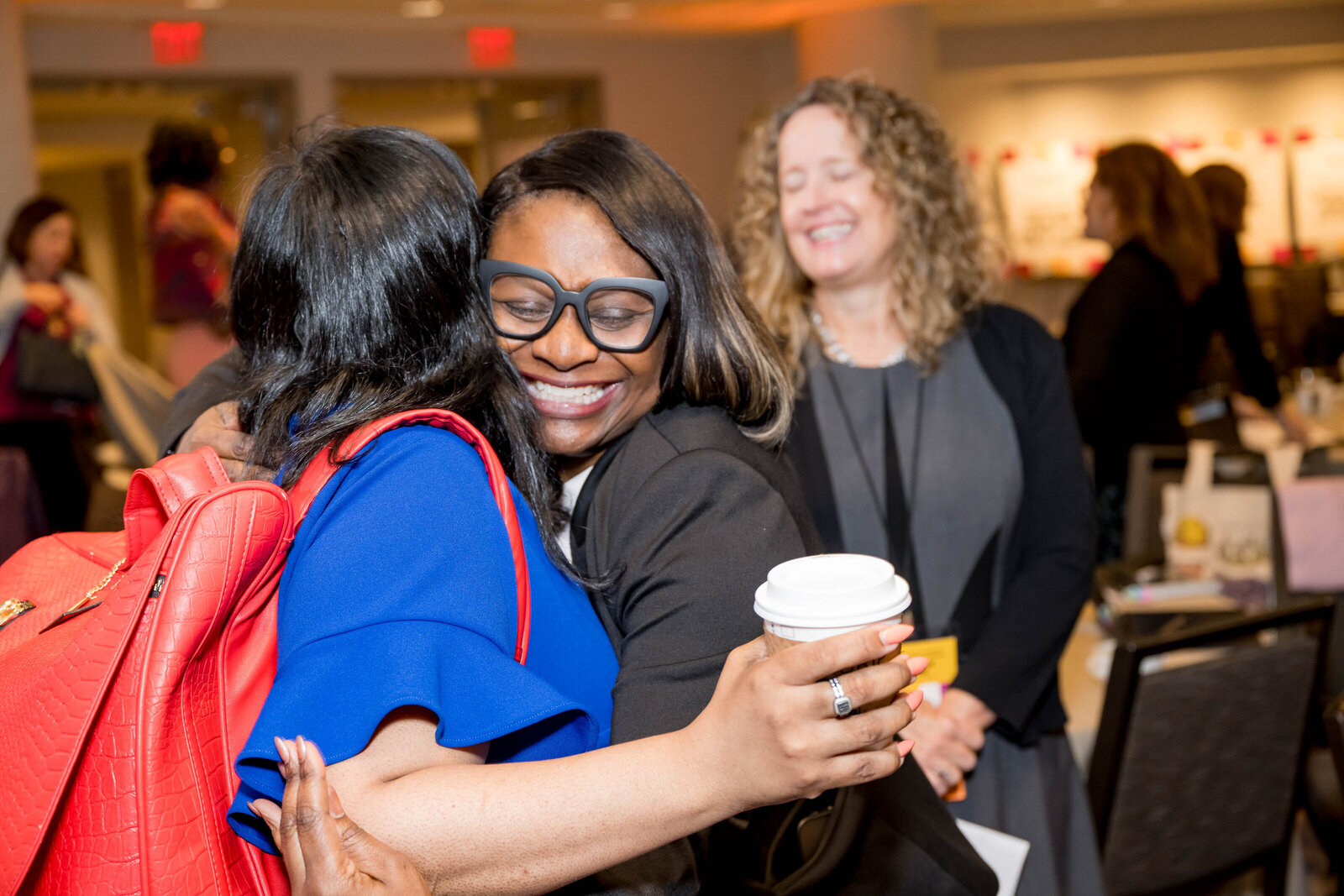 Attendees networking during a conference break