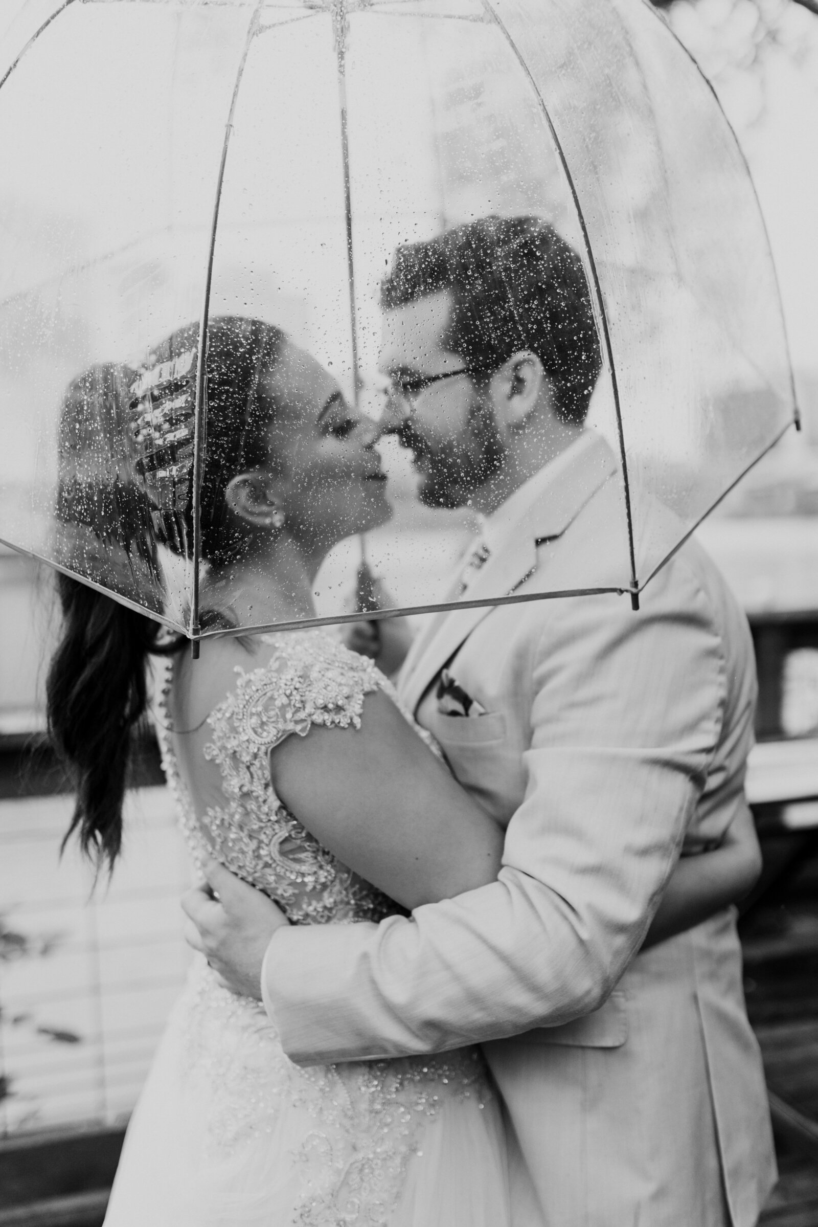bride-groom-raining-portrait-clear-umbrella
