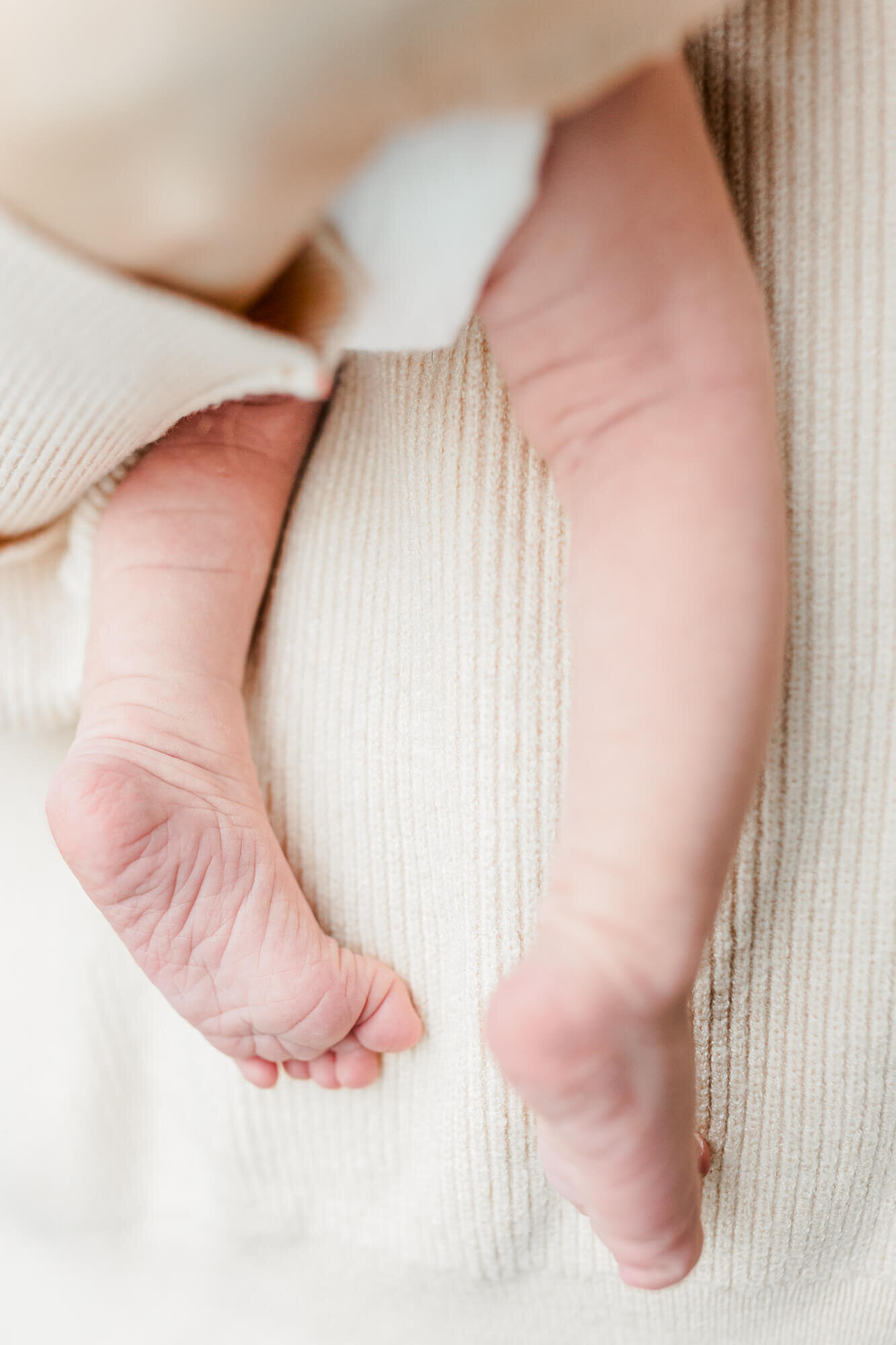 Close up of newborn's wrinkly feet