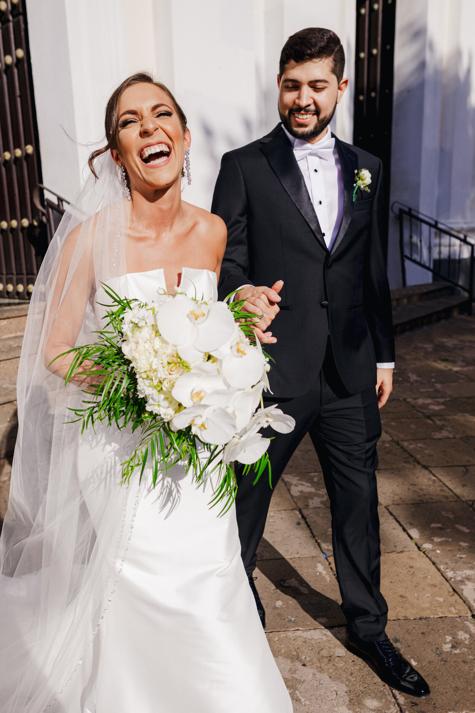 A bride and groom enjoy their first minutes as newlyweds in Old San Juan, Puerto Rico