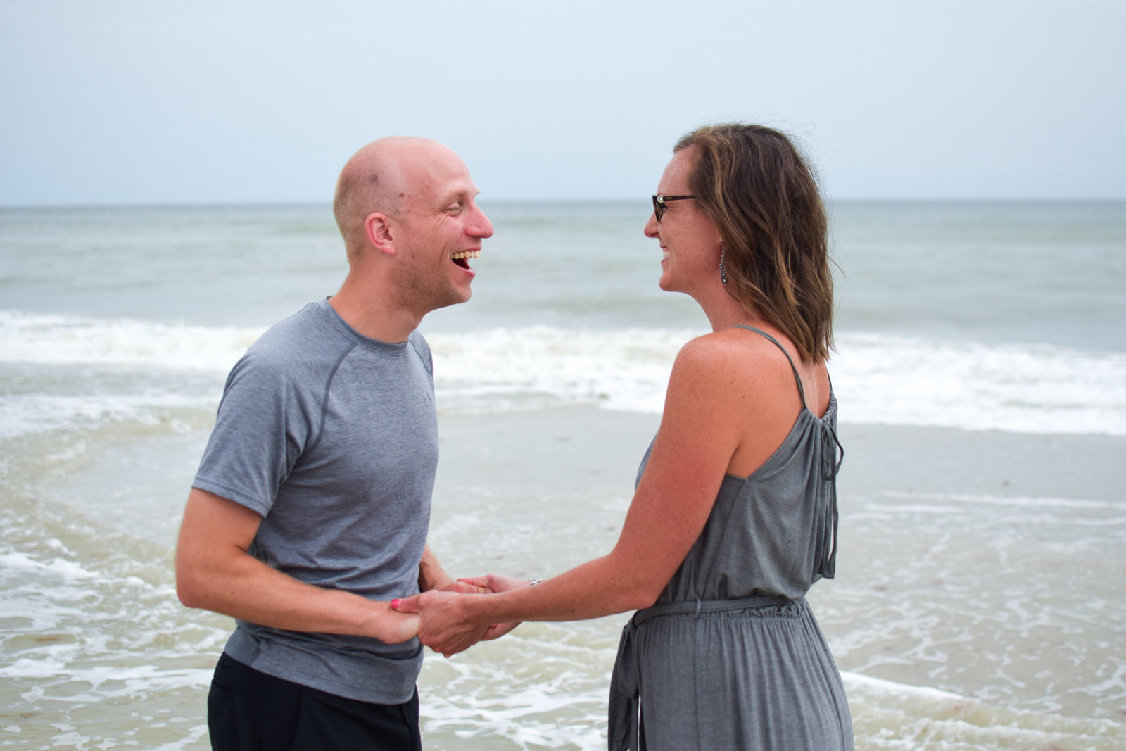 Couple laughing beach Naples Florida