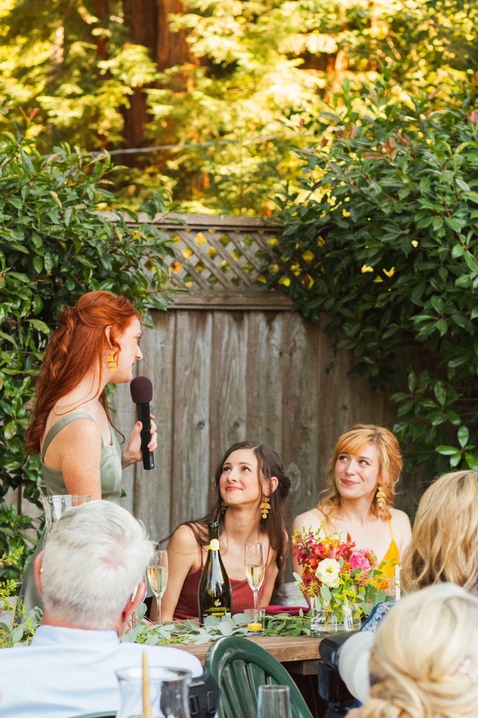 Wedding toasts in Santa Cruz, California in the redwood trees.