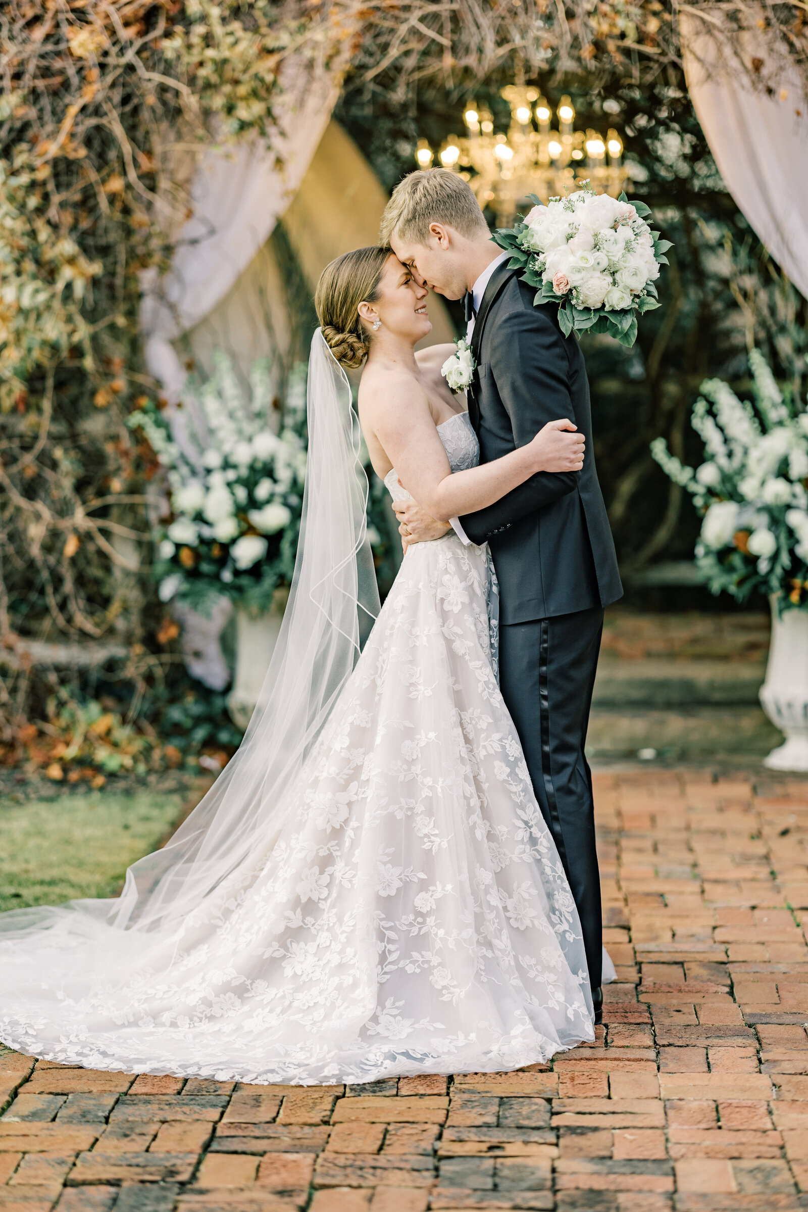 Bride and groom stand forehead to forehead, smiling at each other in a quiet and intimate wedding moment at Inola in Blue Ridge, GA, radiating love and happiness