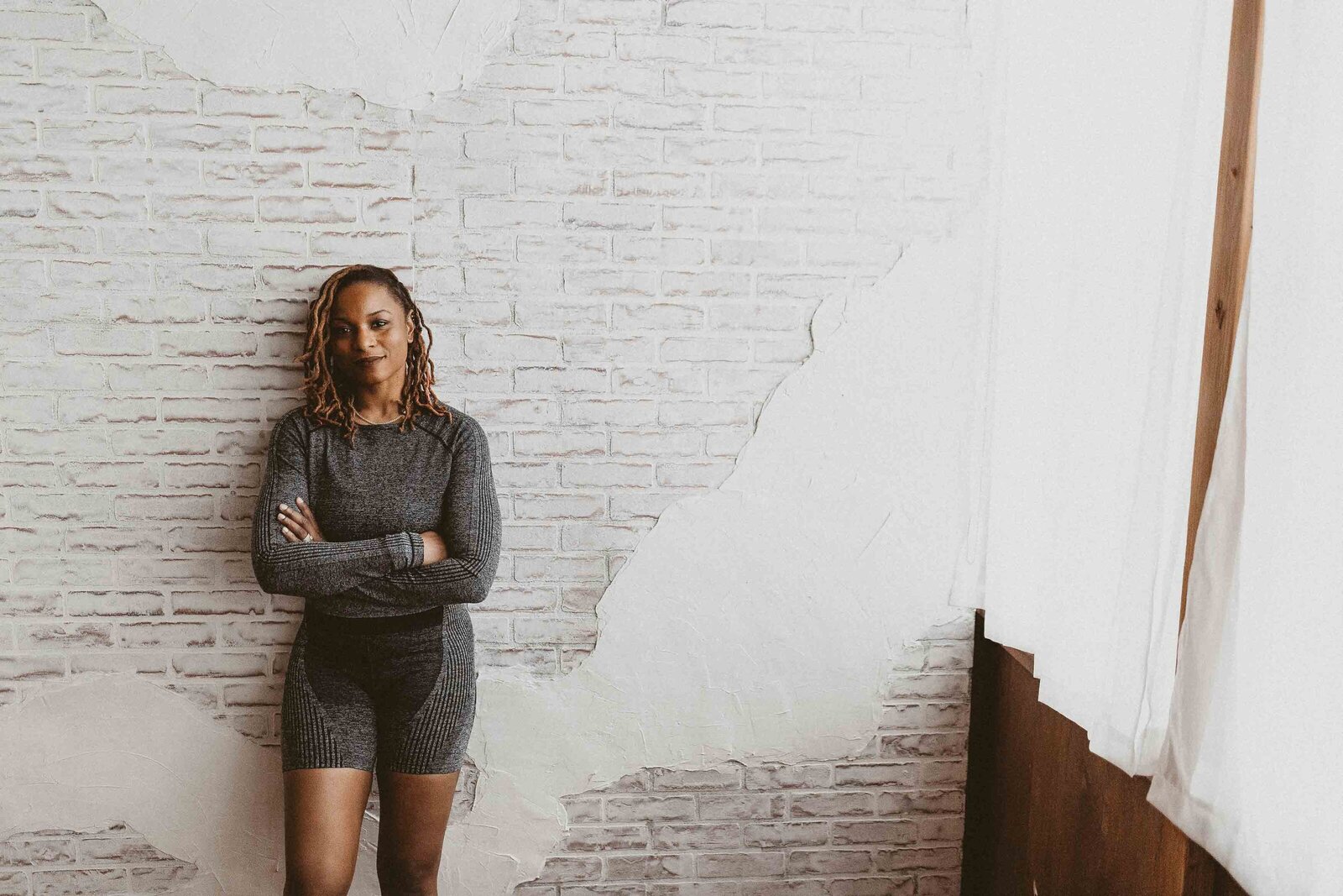 woman leaning on the wall