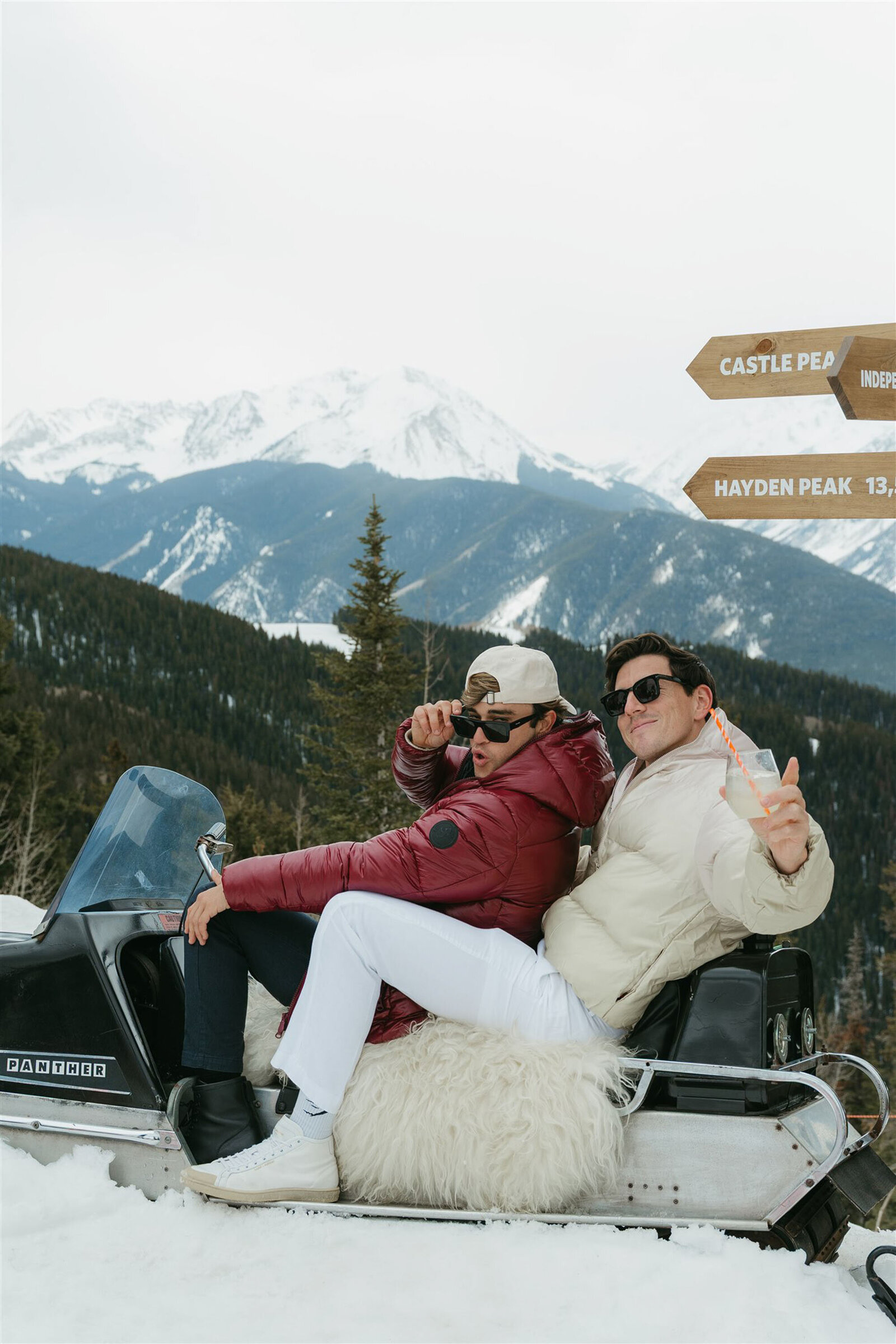 Stylish bride and groom at multi-day Aspen wedding with upscale decor and alpine scenery