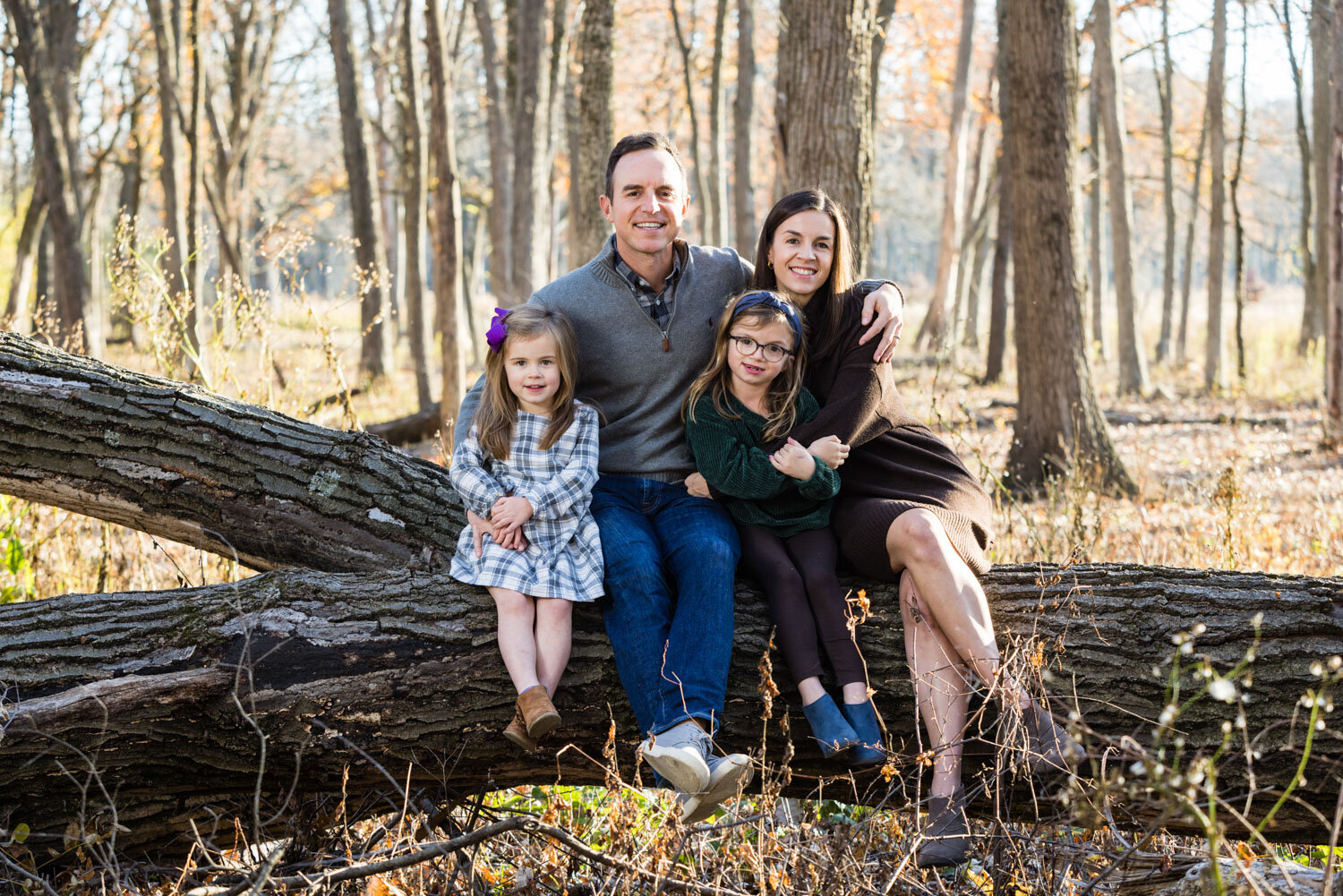 Family of four portrait in an outdoor setting