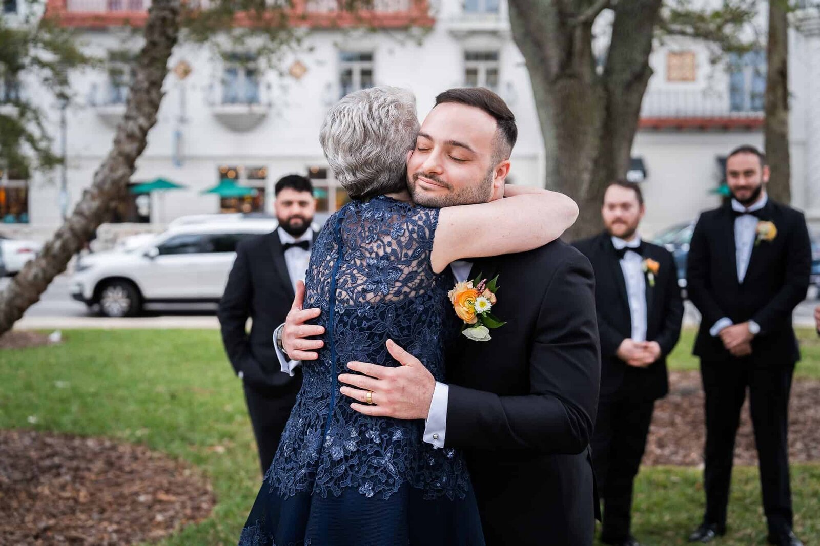 groom and his mother candid photo at jewish wedding at Casa Monica in St Augustine wedding Venue