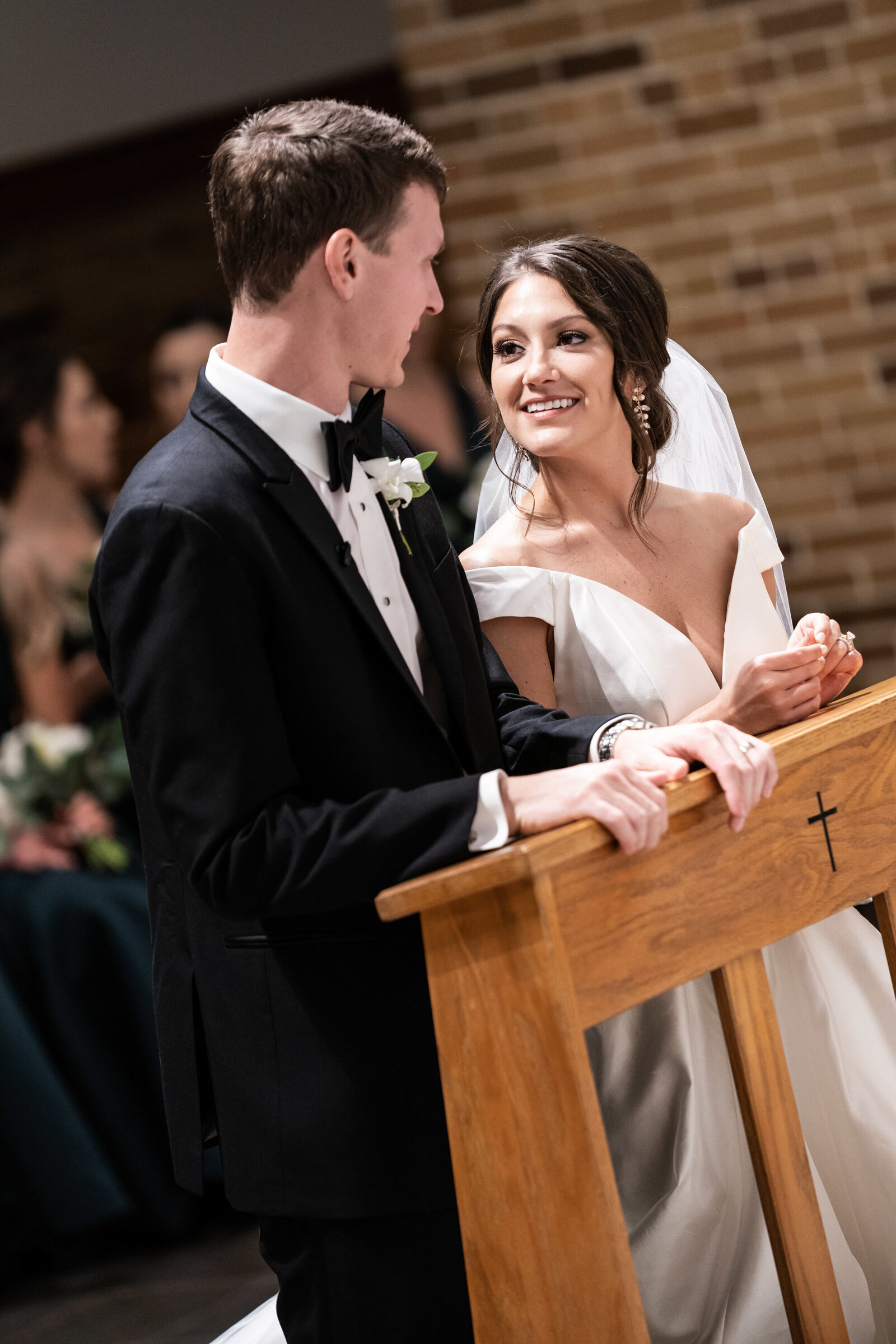 Bride and groom look at each other during wedding ceremony in Covington Louisiana