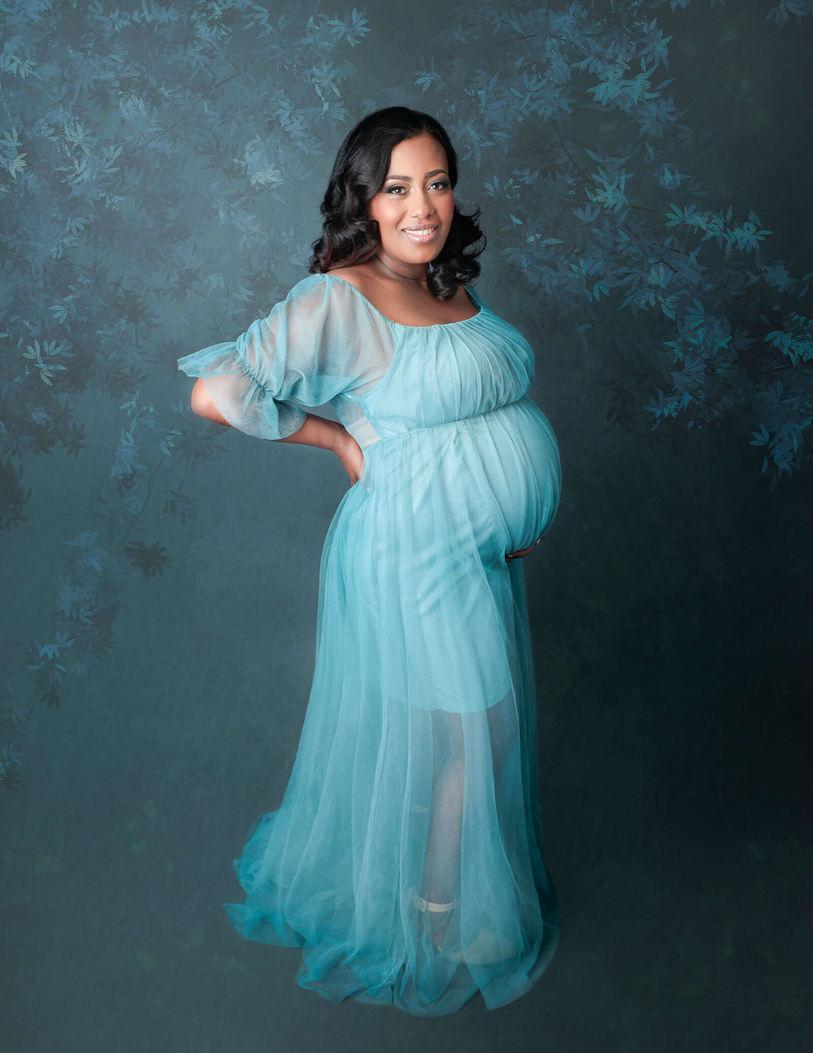 Pregnant mom posed at our Maternity studio in Rochester, NY.