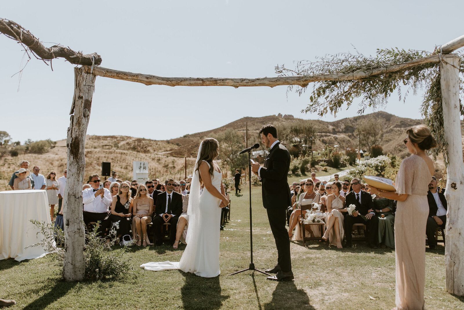 bride and groom at the altar at an outdoor wedding