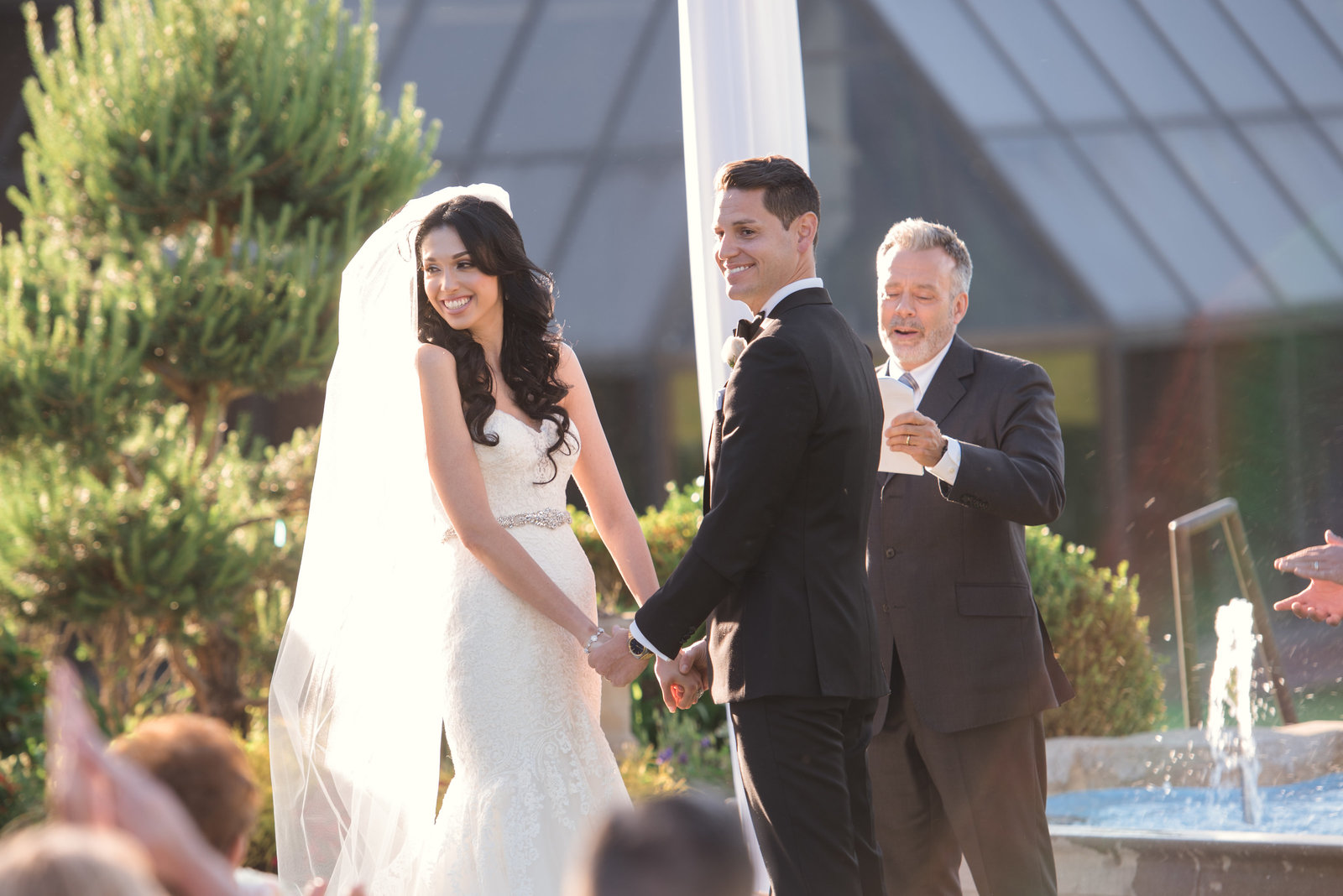 Bride and groom at an outdoor ceremony at Glen Cove Mansion