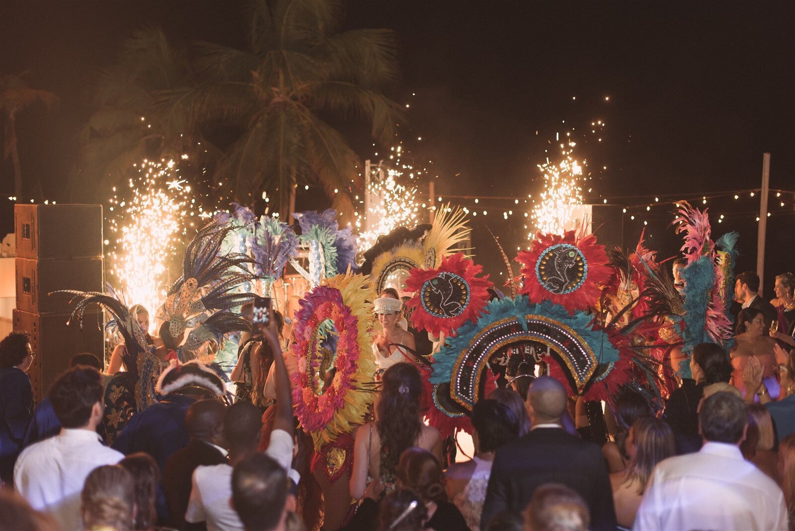 carnival dancers with bride and fireworks in aruba