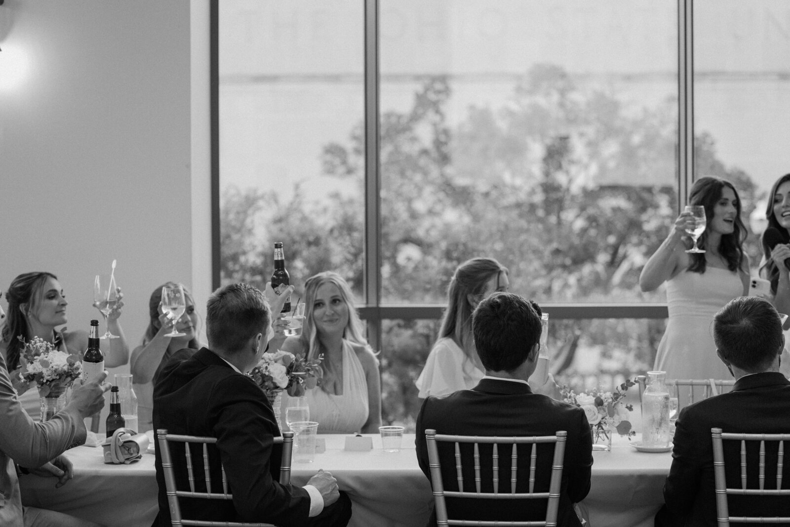 wedding guests clinking glasses