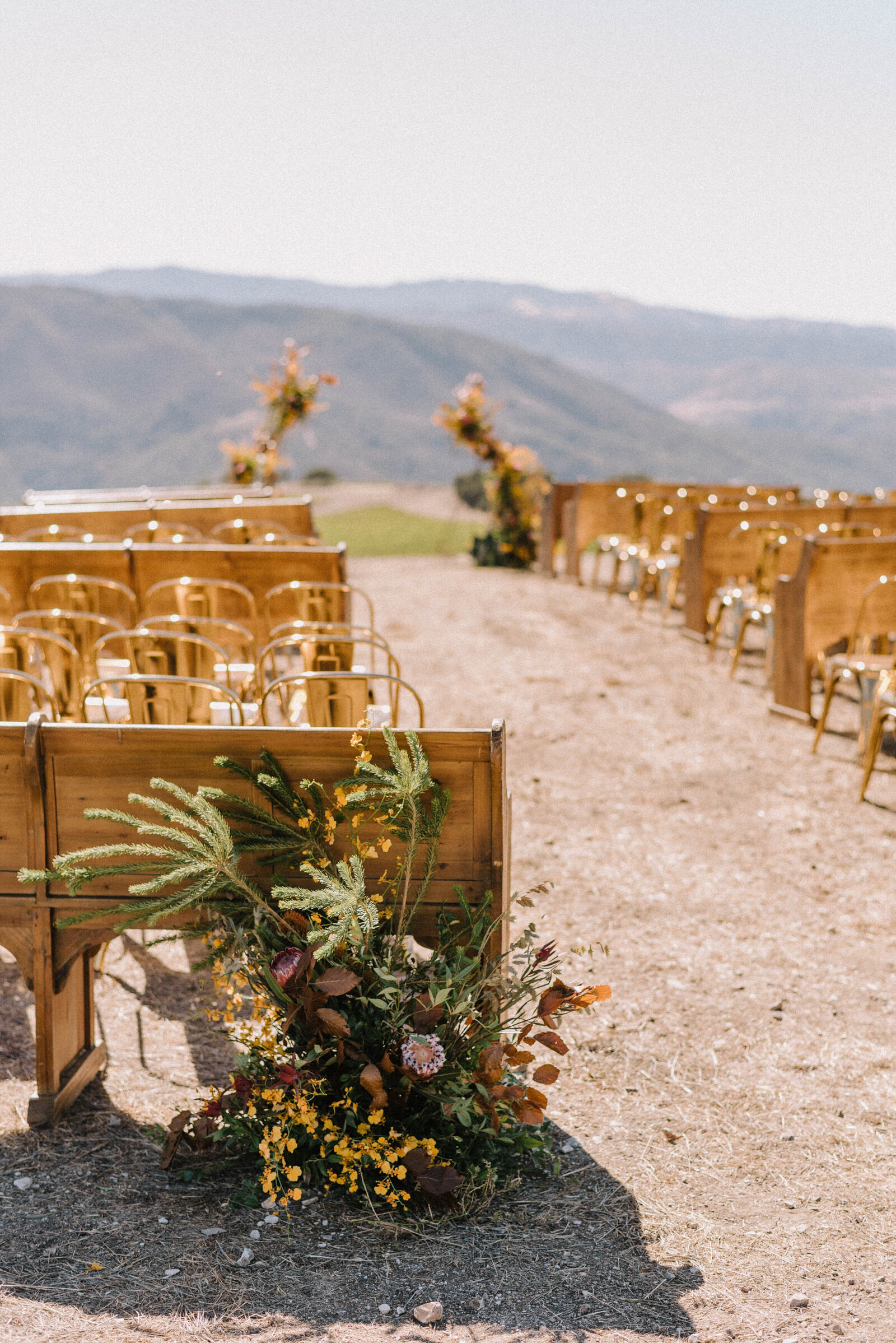 A mixture of benches and chairs for a ceremony at Albatross Ridge