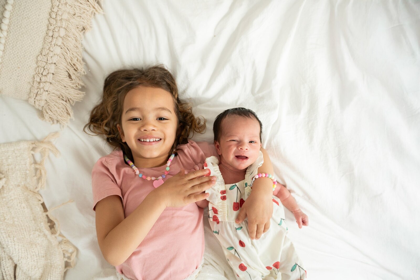 Relaxed newborn session in a light-filled Baltimore home, featuring a swaddled baby in neutral tones.

