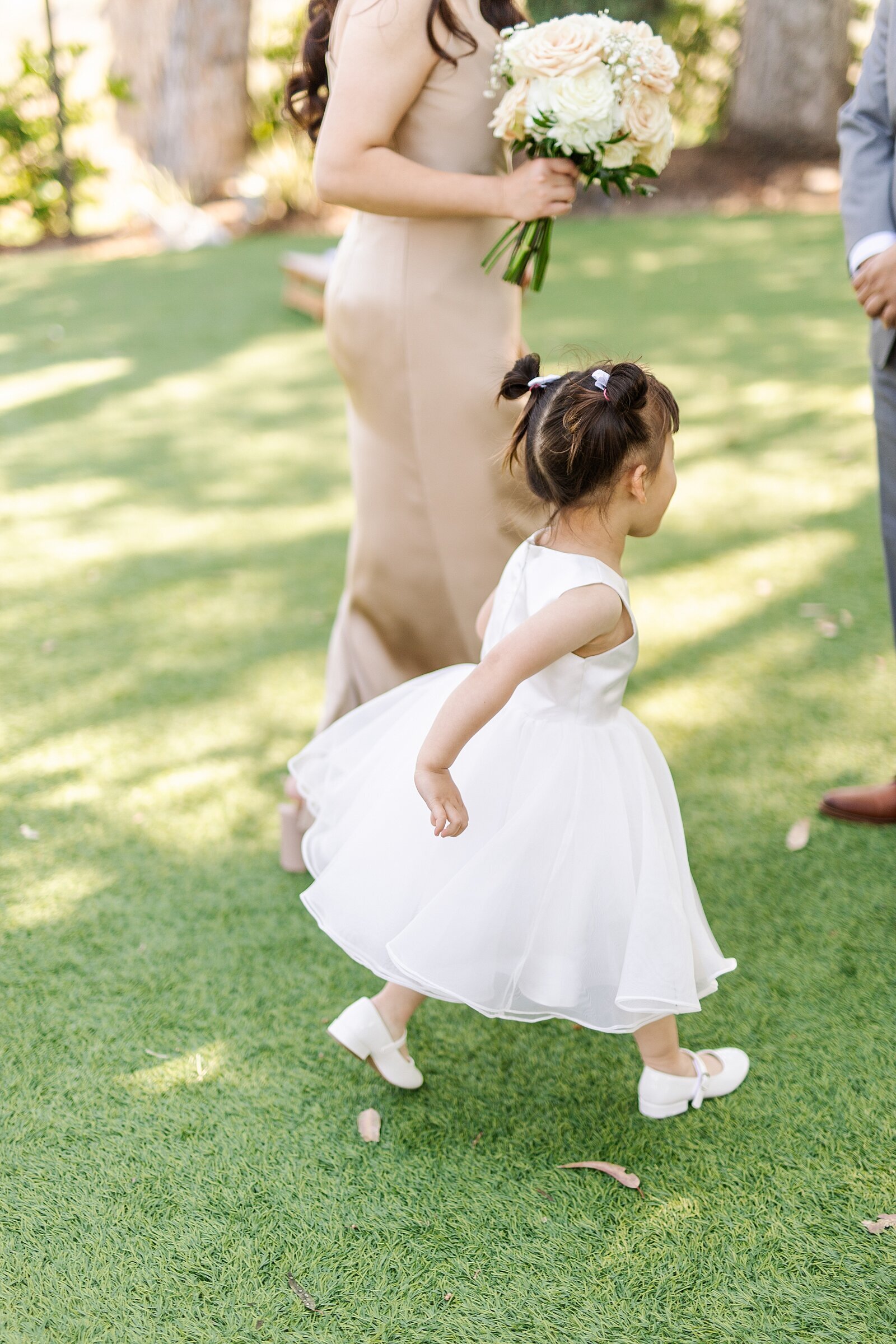 Flower girl running at Falkner Winery in Temecula, California.