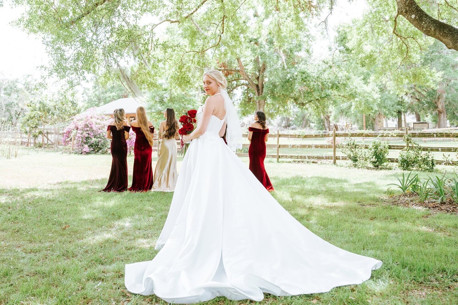 Bridal portraits at Magnolia Building wedding in Lakeland - reveal with the bridesmaids
