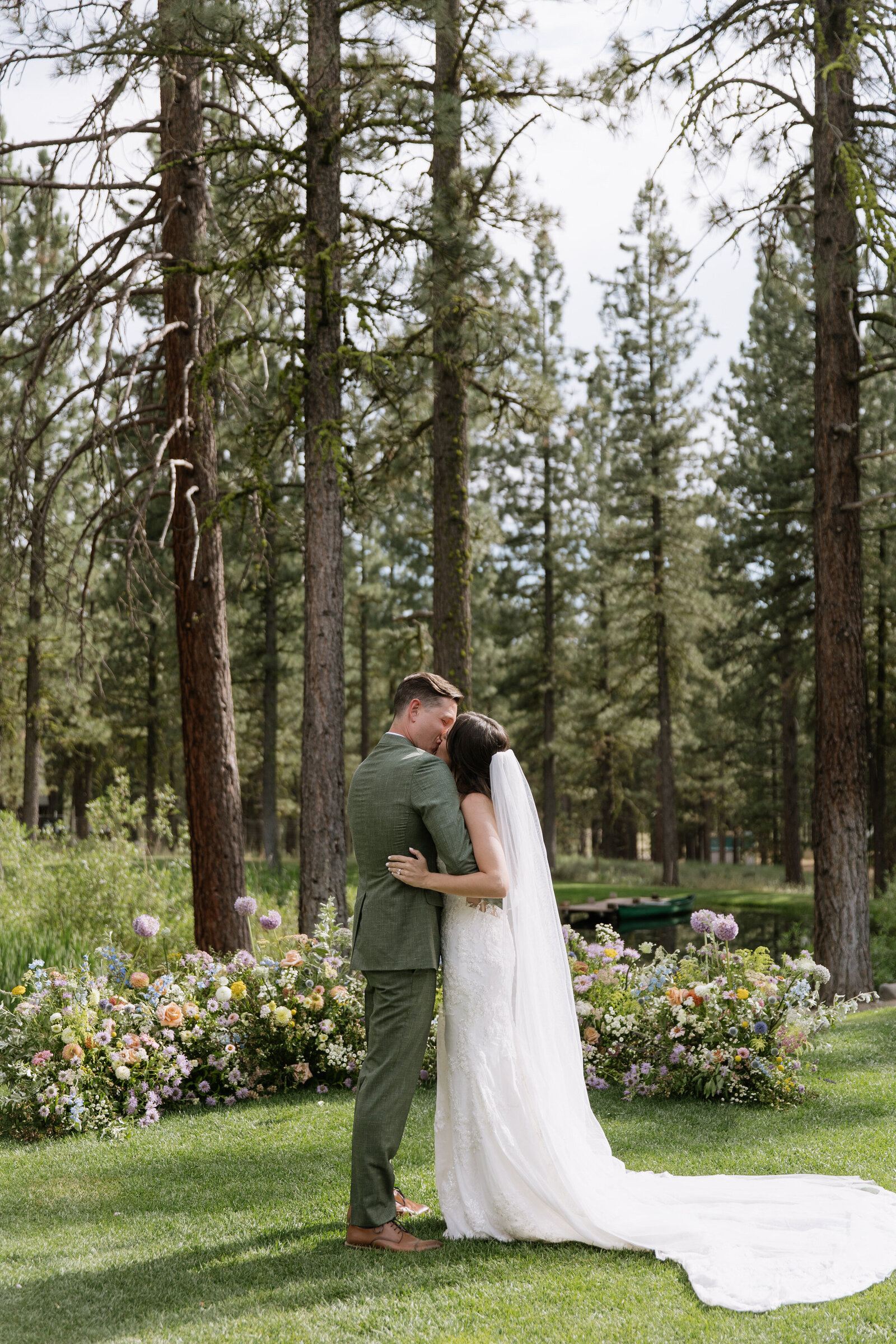 Bride and groom kissing after ceremony in Lake Tahoe woods