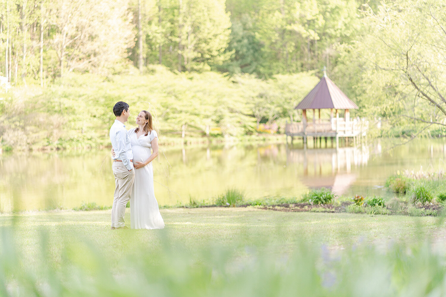 parents look at each other taken by Fairfax County, Virginia maternity photographer