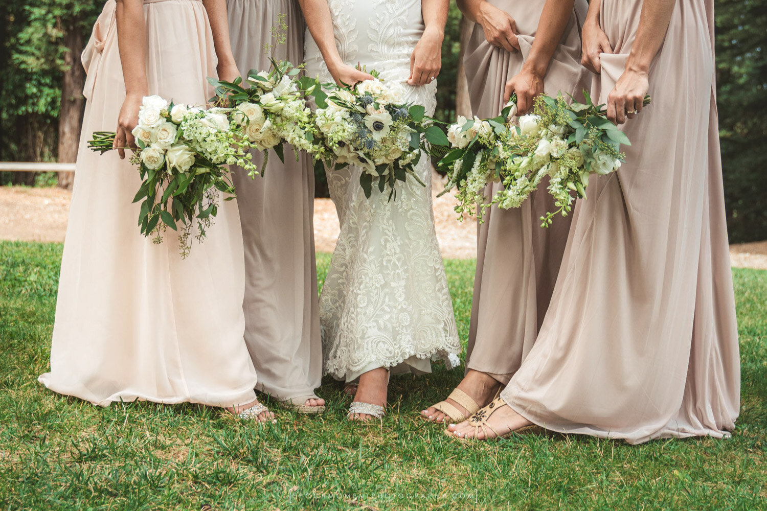 Bride with her bridesmaids holding their bouquet for pictorial