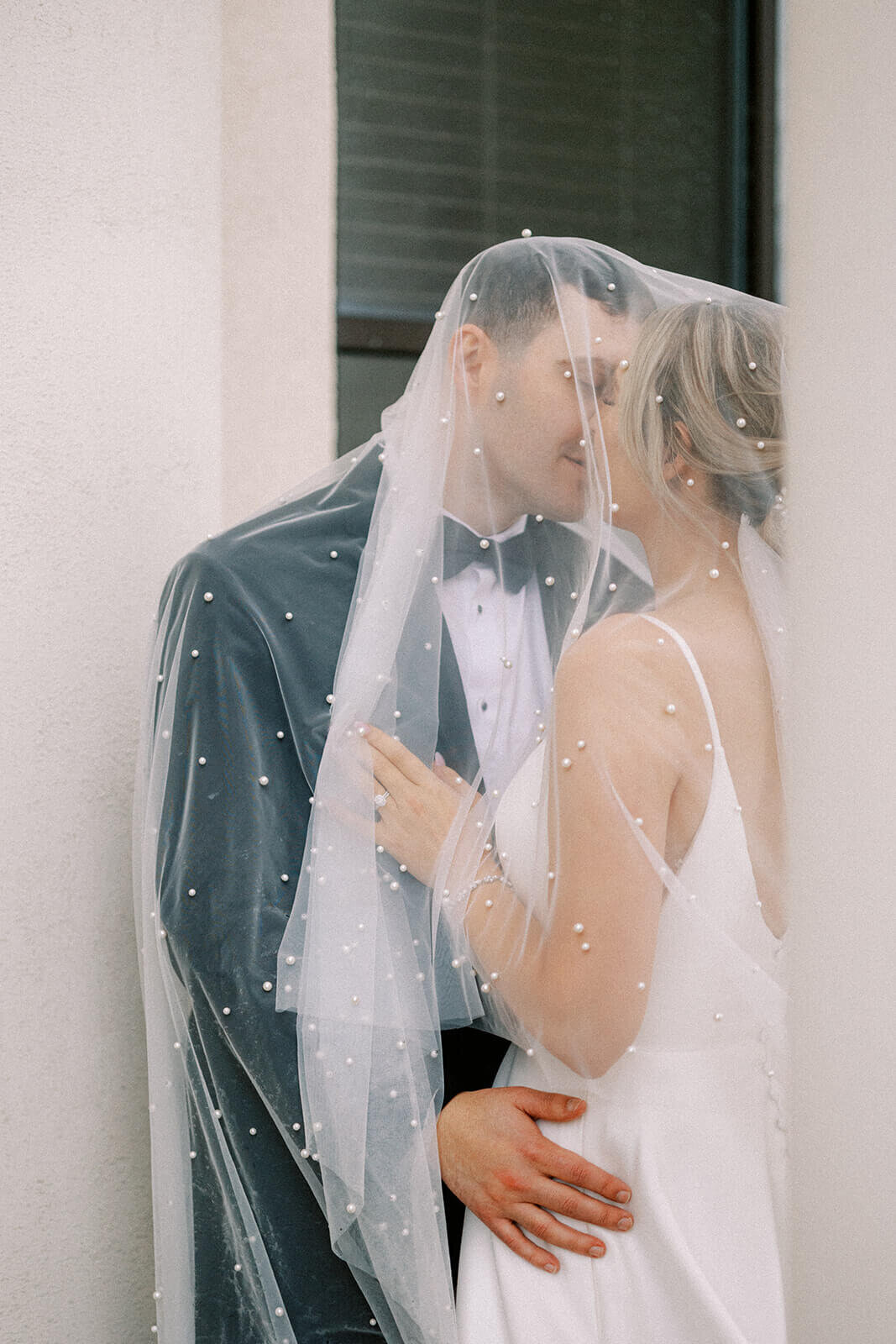 bride-under-veil-with-groom