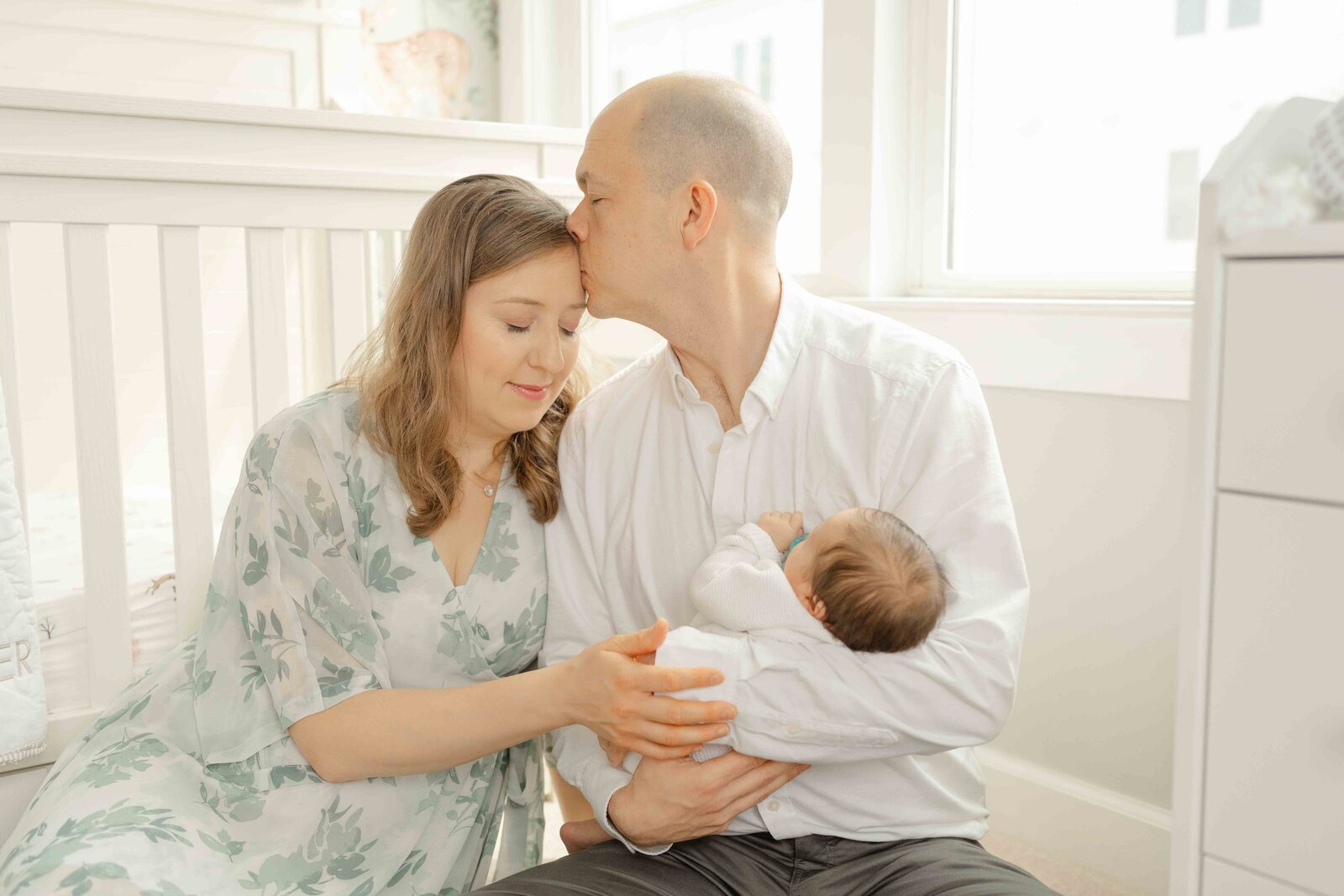 dad kisses mom taken by newborn photographer Fairfax County,VA