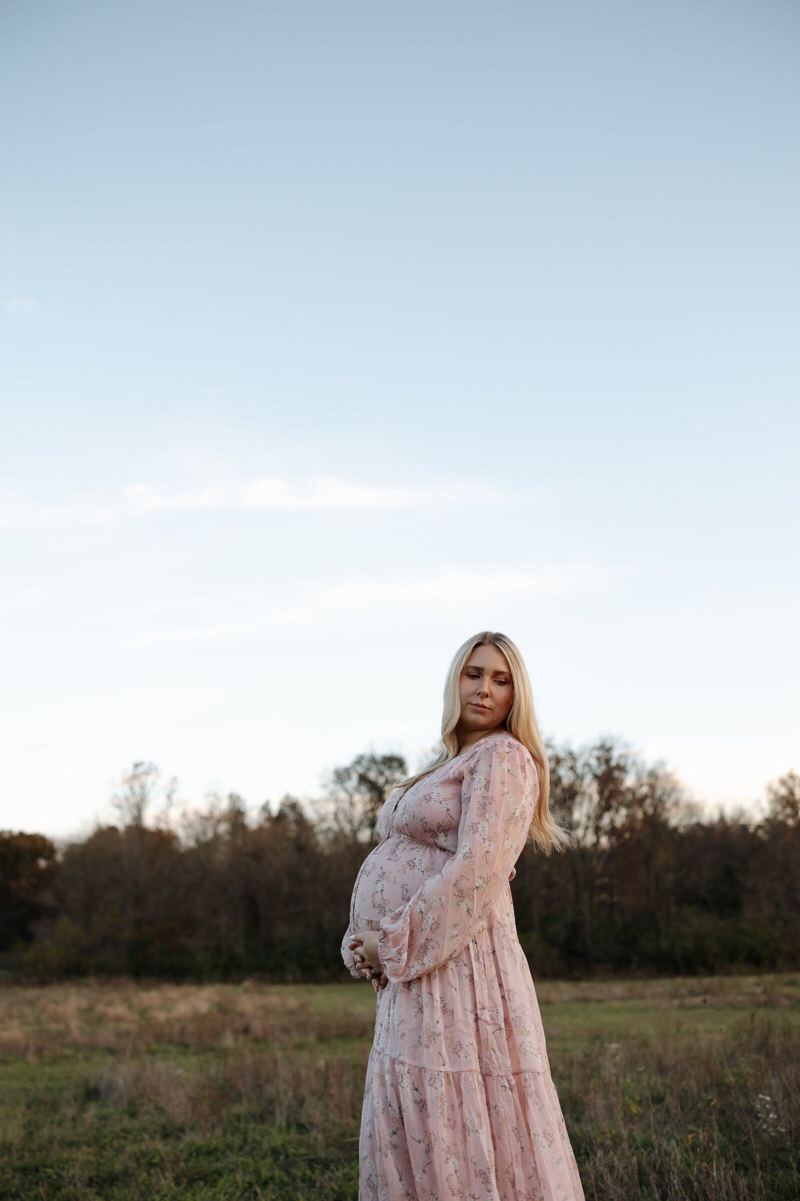 mama to be during maternity session at August Busch in St. Charles
