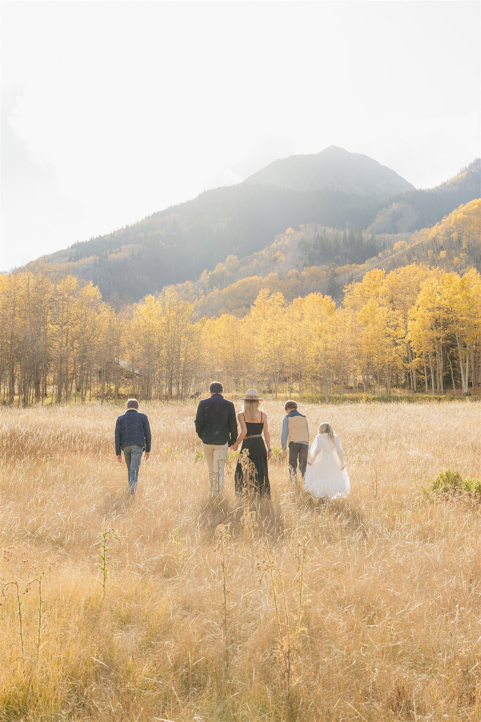 Vogue-inspired Aspen family photo with timeless styling, rich textures, and Colorado mountain scenery.