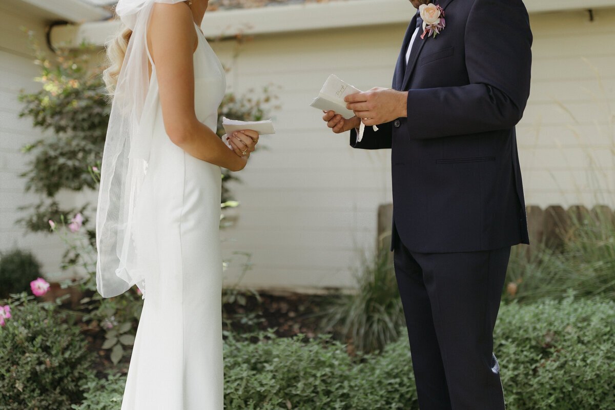 Bride and groom holding glasses by washington elopement photographers
