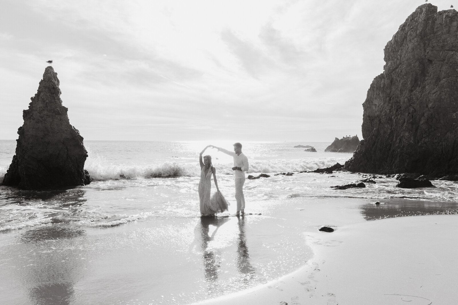West Coast wedding dreams realized at El Matador Beach. Sunset portraits, ocean breezes, and timeless romance captured in black & white.