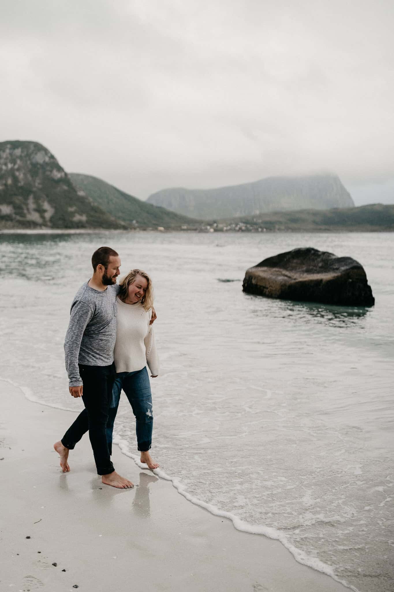 Couple walking at the beach in Nordic country