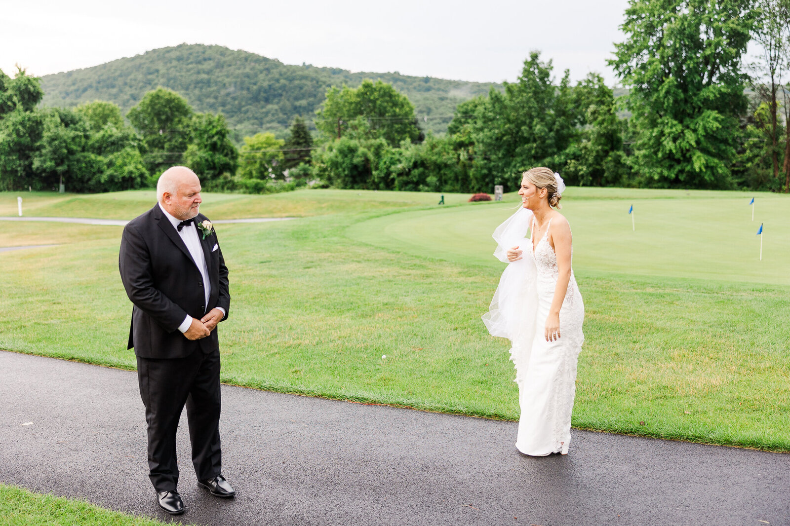 Heartfelt first look between bride and her father on wedding day at SkyView Golf Club in Sparta, NJ